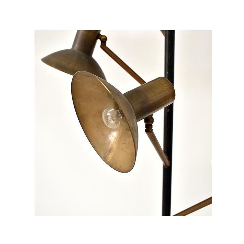 1950s floor lamp, Italian manufacture.
The lamp has five adjustable brass light points with a black iron stem.