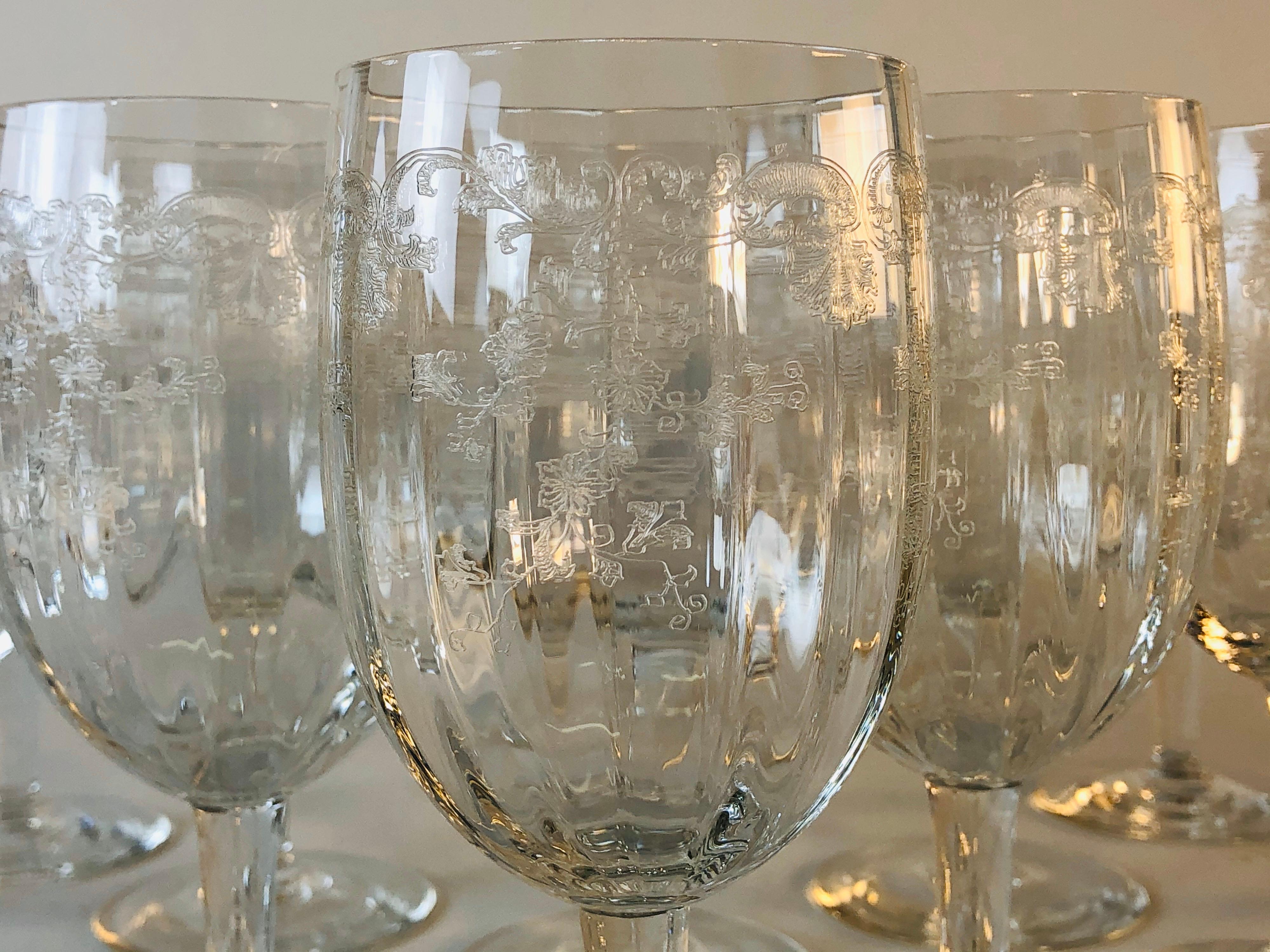 Vintage 1950s set of 12 floral etched wine stems. The etching covers the entire stem. No marks. Excellent condition.