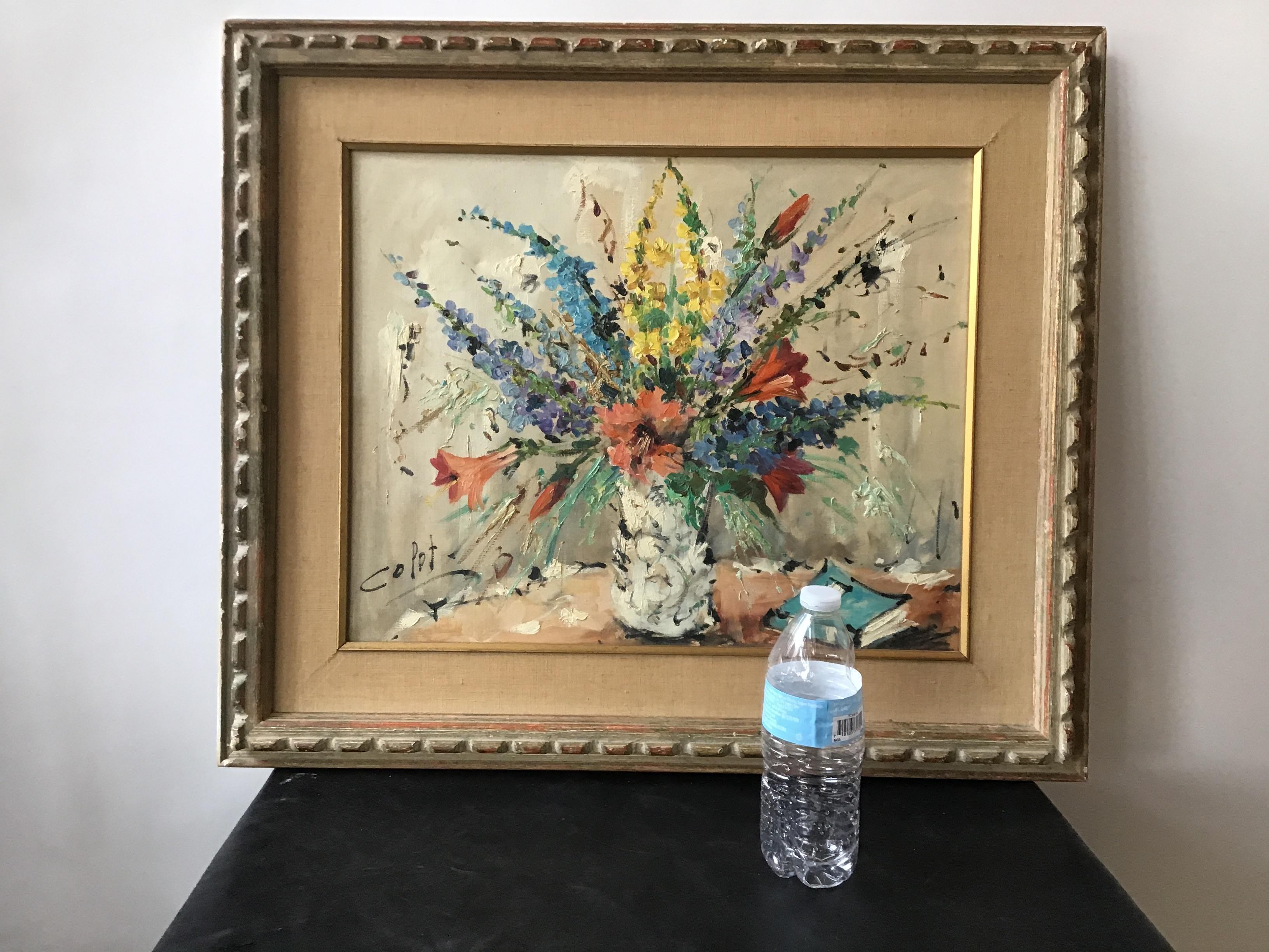 1950s oil on canvas painting of floral arrangement in a wood frame. Signed.