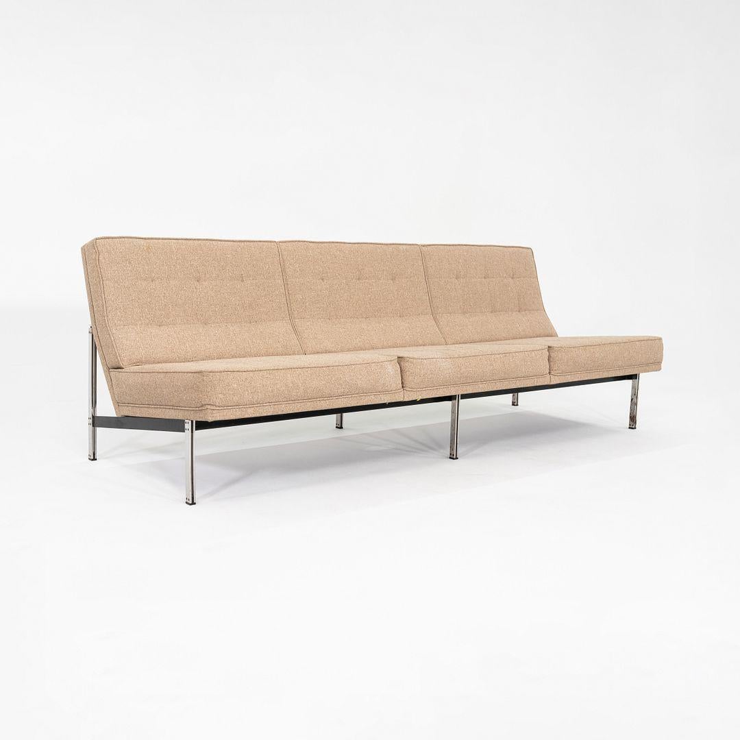 This is an early Florence Knoll Parallel Bar System Sofa, Model 53, initially designed by Florence Knoll in 1955. The sofa features an updated oatmeal hopsack upholstery which was professionally redone by Modernica in L.A.. The design has a
