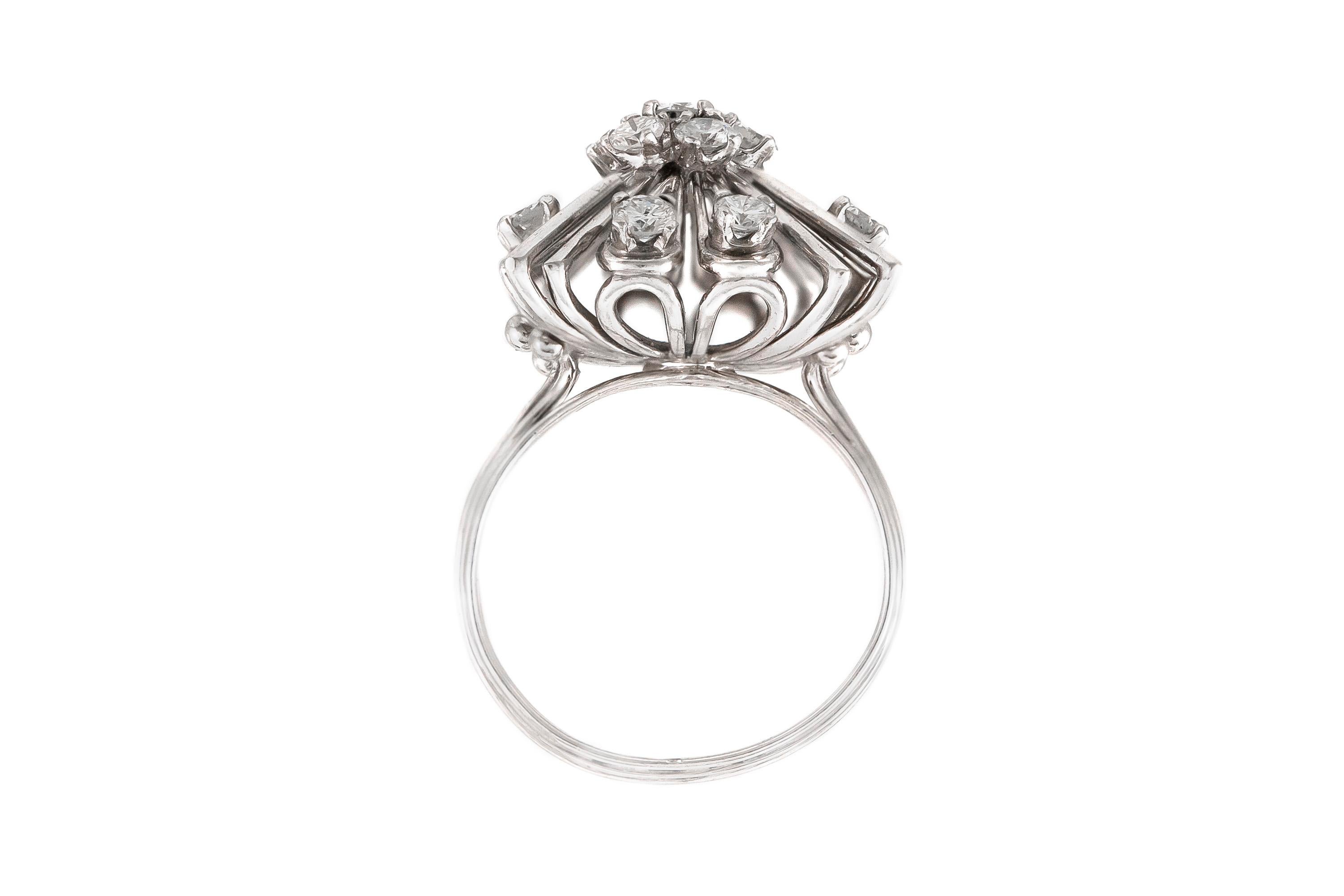 The ring is finely crafted in platinum with diamonds weighing approximately total of 1.60 carat.
Size 8.00 ( easy to resize )
Circa 1950'S