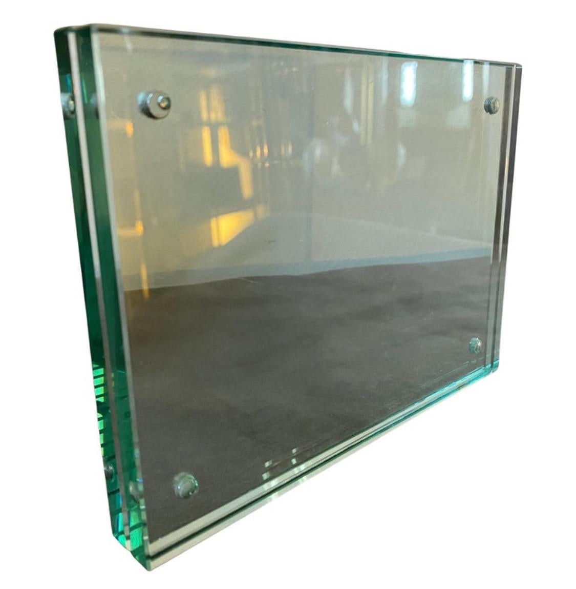 An elegant Mid-Century Modern heavy verde Nilo glass rectangular picture frame designed and manufactured in Italy, quality of glass and cleanliness and rigor of its lines suggests that it was built by Fontana Arte. It's in perfect condition. The