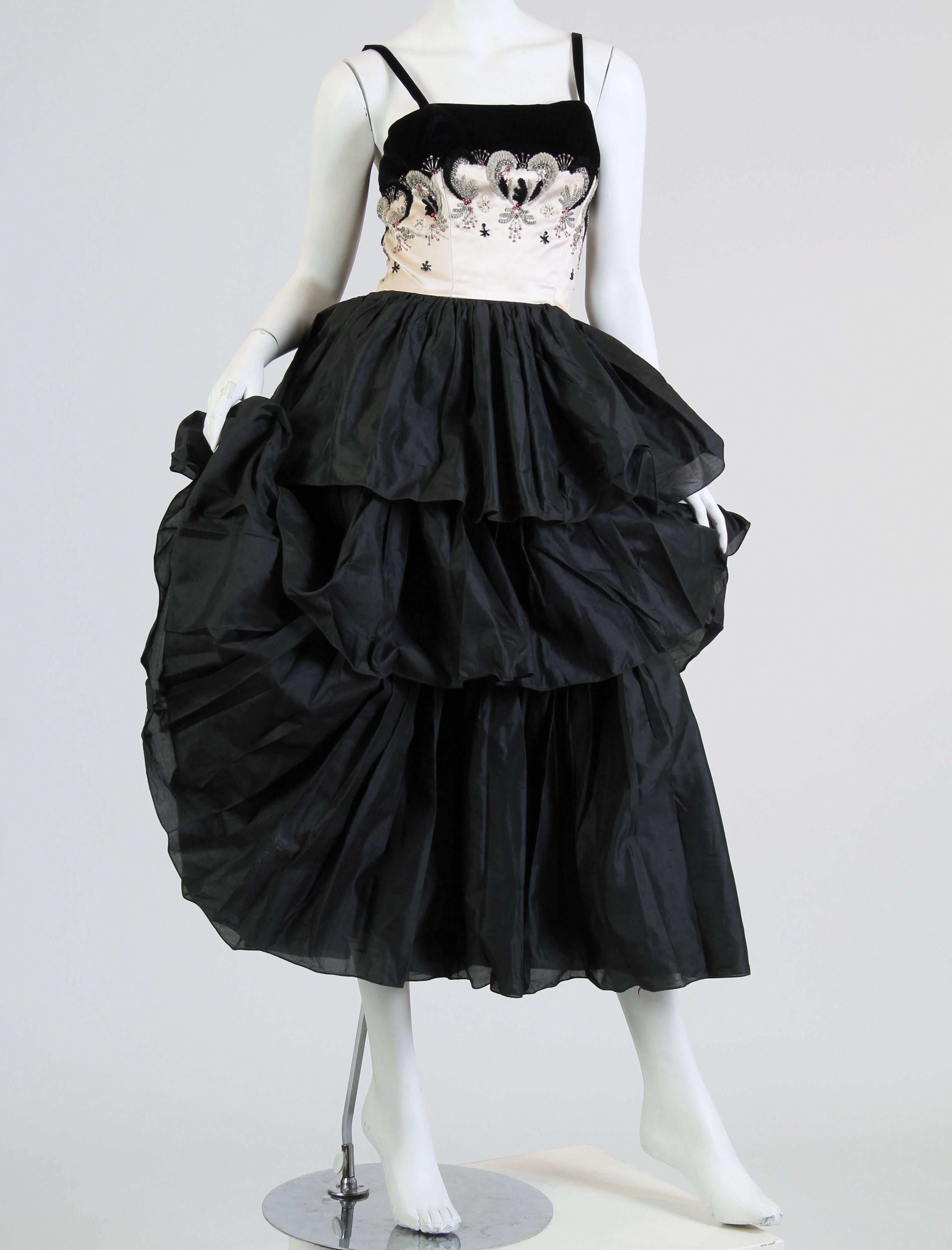 in good condition however the bodice shows pin holes where the dress was taken in and then let back out with a new zipper. 1950S FONTANA COUTURE Black & White Silk Dupioni Tiered Skirt Gown With Velvet Embroidered Beaded Satin Bodice 