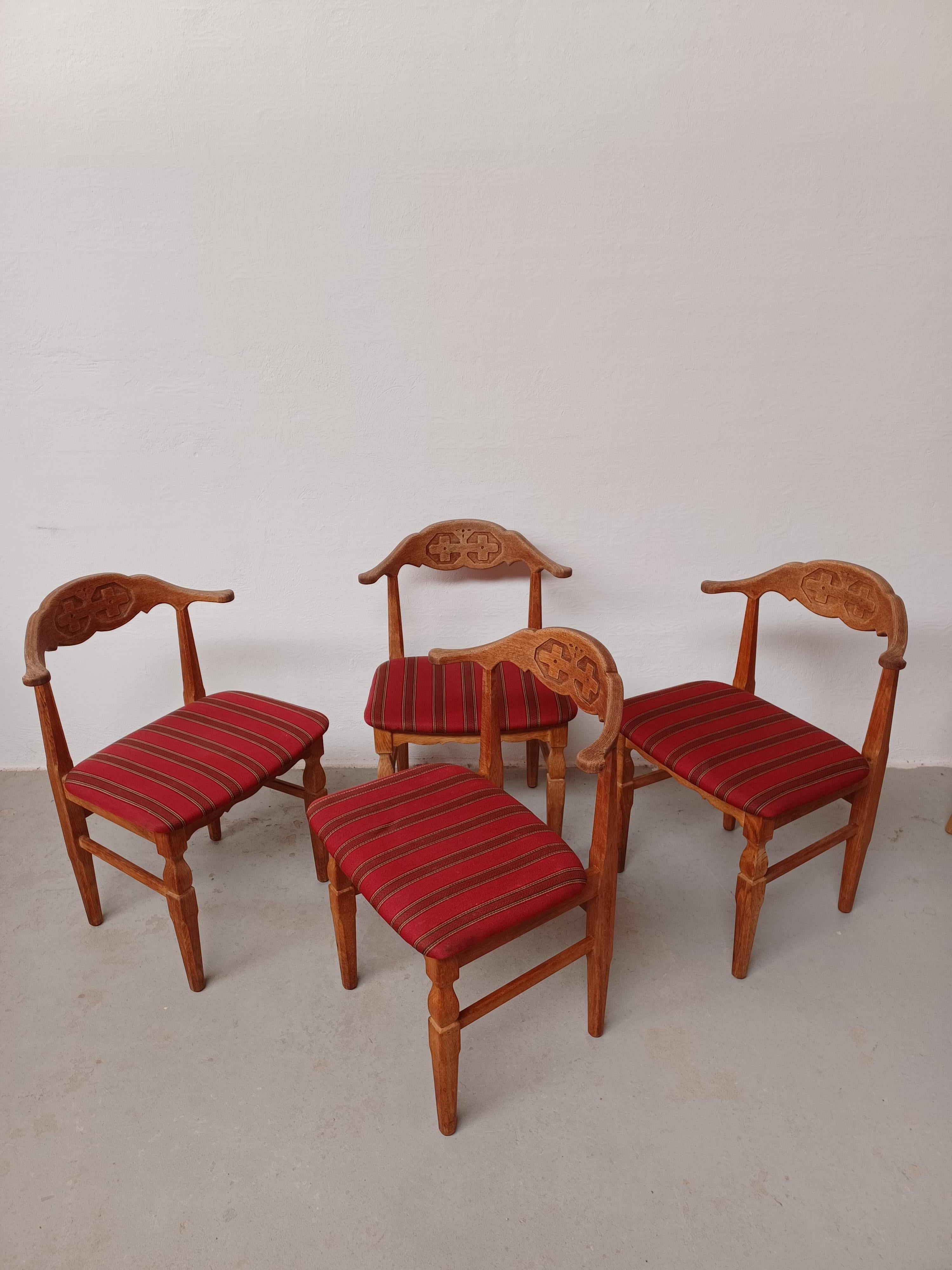Set of 4 original Danish 1970s Brutalist chairs by Henning Kjærnulf for EG Møbler. 
The chairs are in solid patinated oak with original upholstery retained, in good vintage condition.

The chairs by some named the 