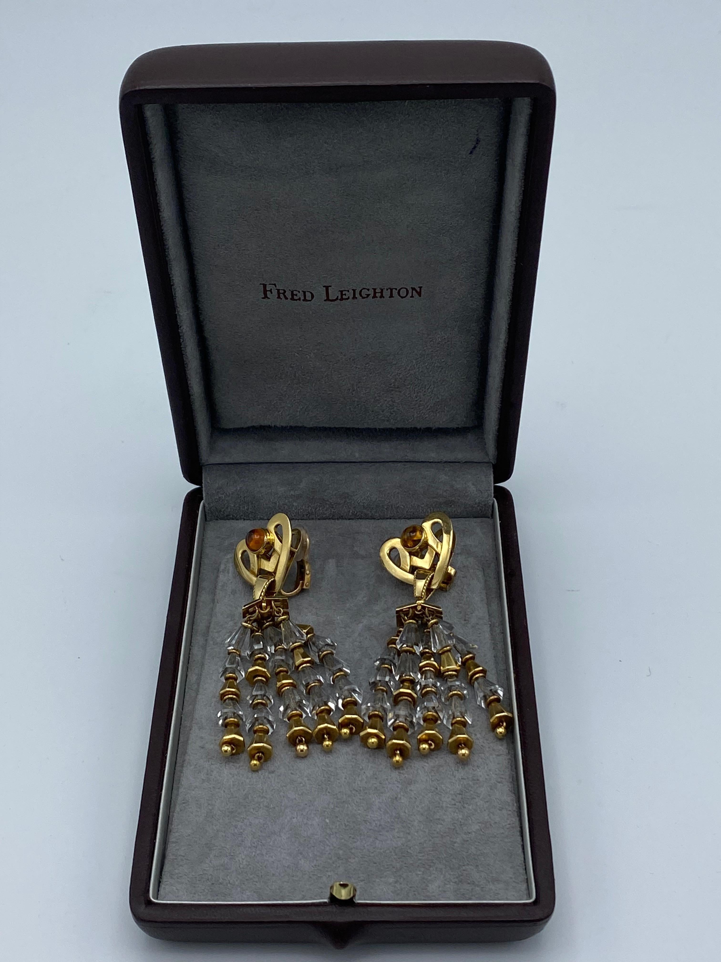 Product details:

The earrings are made out of 18 karat yellow gold, detailed with citrine and rock crystal, featuring heart motif and clip on style. Made in France.

