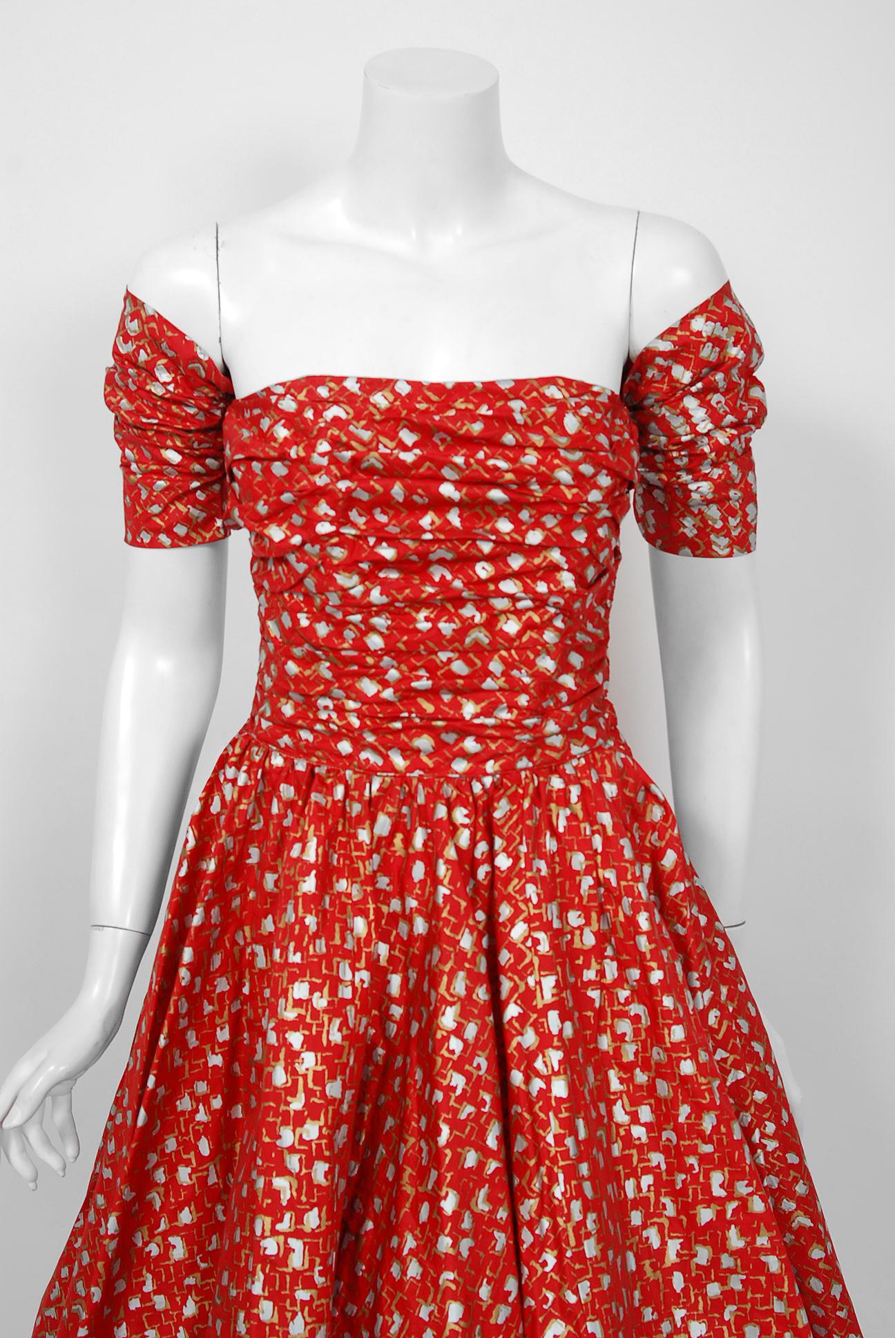 A magnificent 1950's creation by the iconic dress designer Fred Perlberg. It's hard to believe this beauty is over 60 years ago; as she looks so modernly fresh! This gorgeous garment is fashioned from atomic metallic printed light-weight silk in the