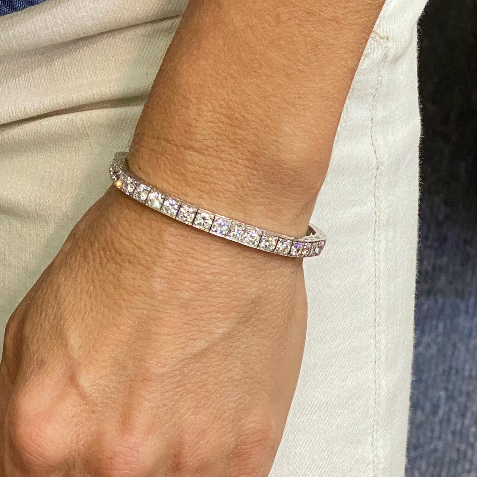 1950's diamond line bracelet fashioned in 14 karat white gold. The 37 round brilliant cut diamonds weigh approximately 9.25 carat total weight and are graded F color and VS clarity. Each diamond is approximately .25 carats. The bracelet measures 6.5
