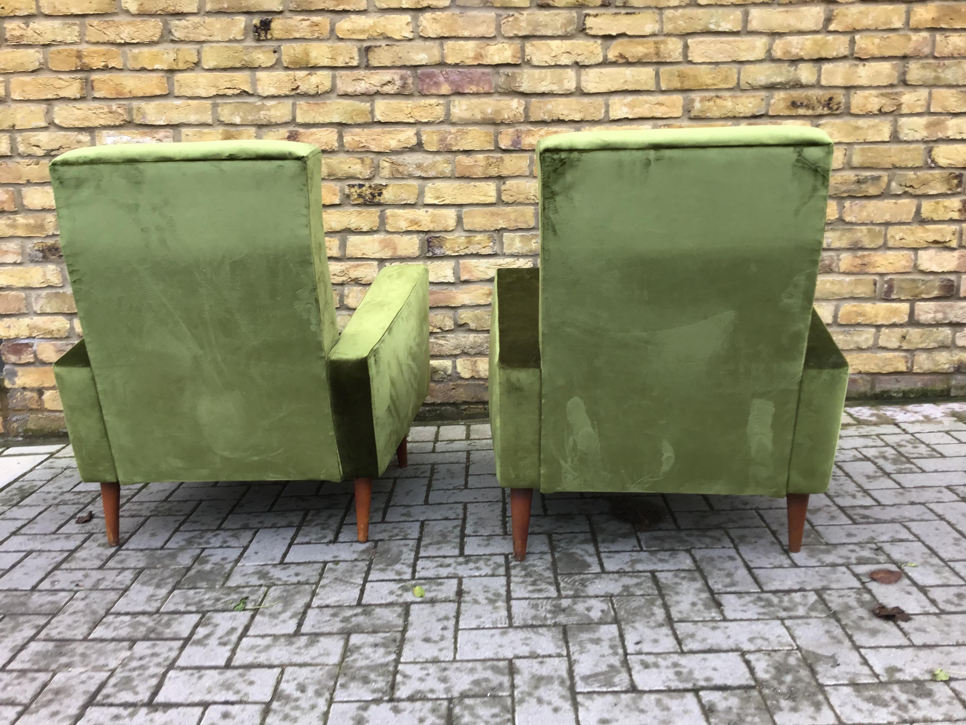 Reupholstered and restored
pair of armchairs in green velvet high back and super comfortable, circa 1950s, French.

   