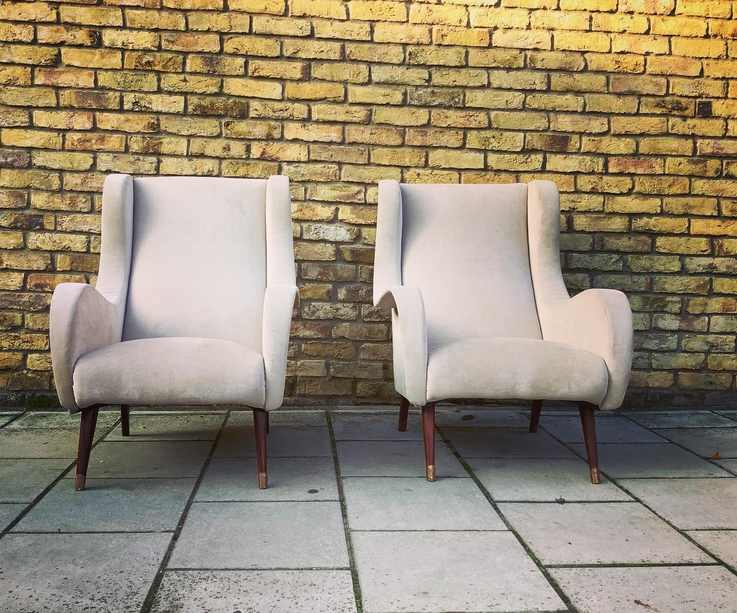 Fantastic shaped pair of 1950’s French armchairs in a warm light fabric.