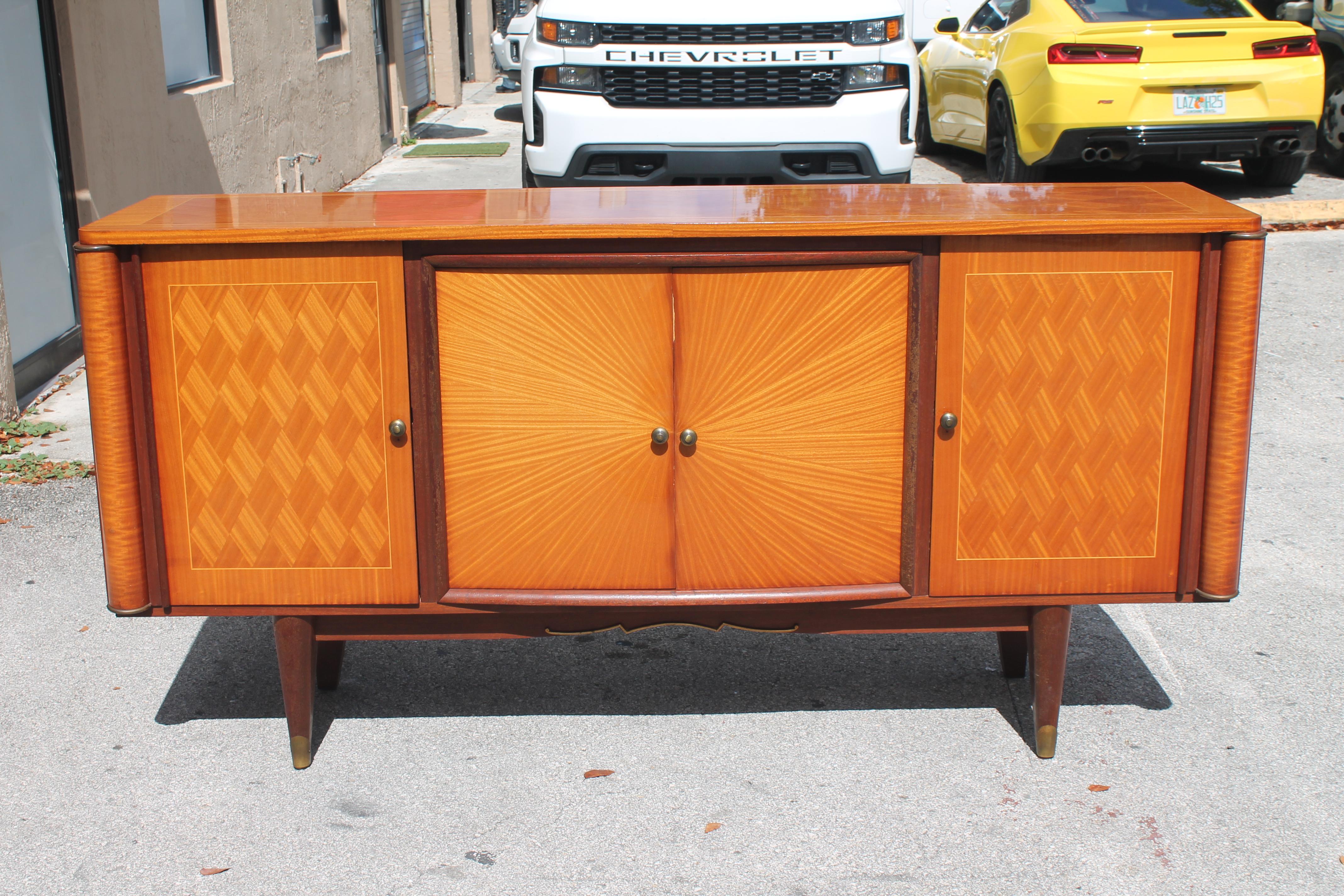 1950's French Art Deco style/ Modern Sycamore with Walnut Buffet. Stunning Sun Rise / Sun Ray Motif. Interior dry bar area and shelving. Diamond inlay detail. French Estate.