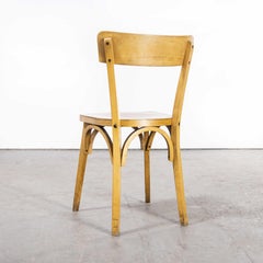 Ensemble de neuf chaises Baumann en bois cintré à dossier mince blond des années 1950, ensemble à arlequins