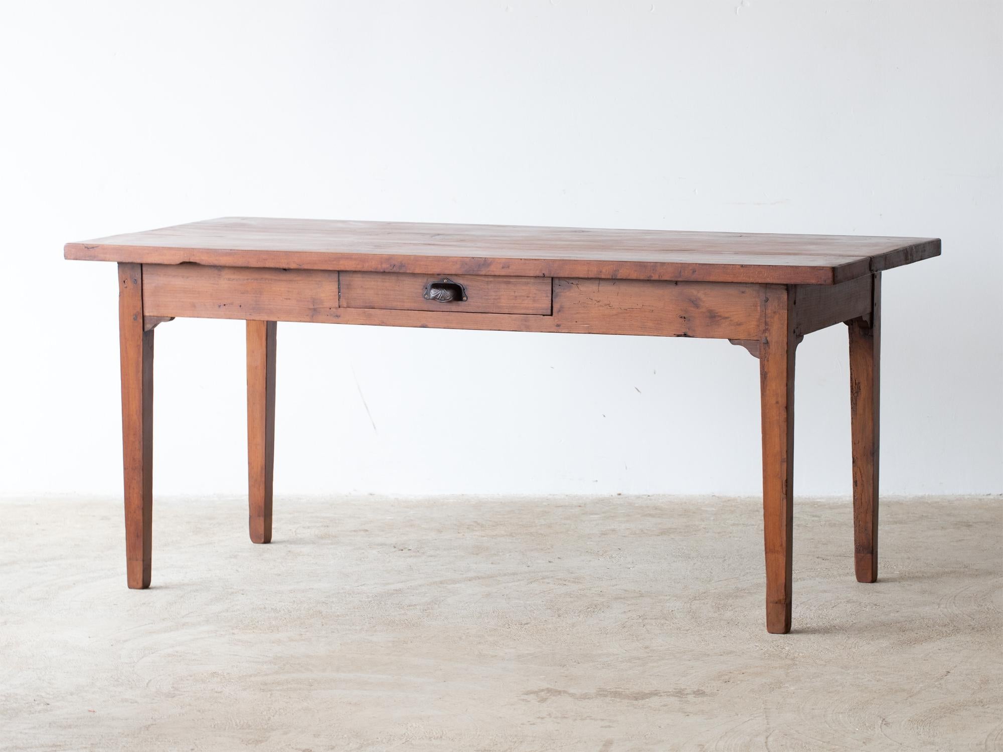 A beechwood farmhouse dining table with drawer to one side. Central France, c. 1950s.

Stock ref. #2236

In good sturdy order with characterful wear. All timber treated as a precautionary and preventative measure.

Note: considered restoration work