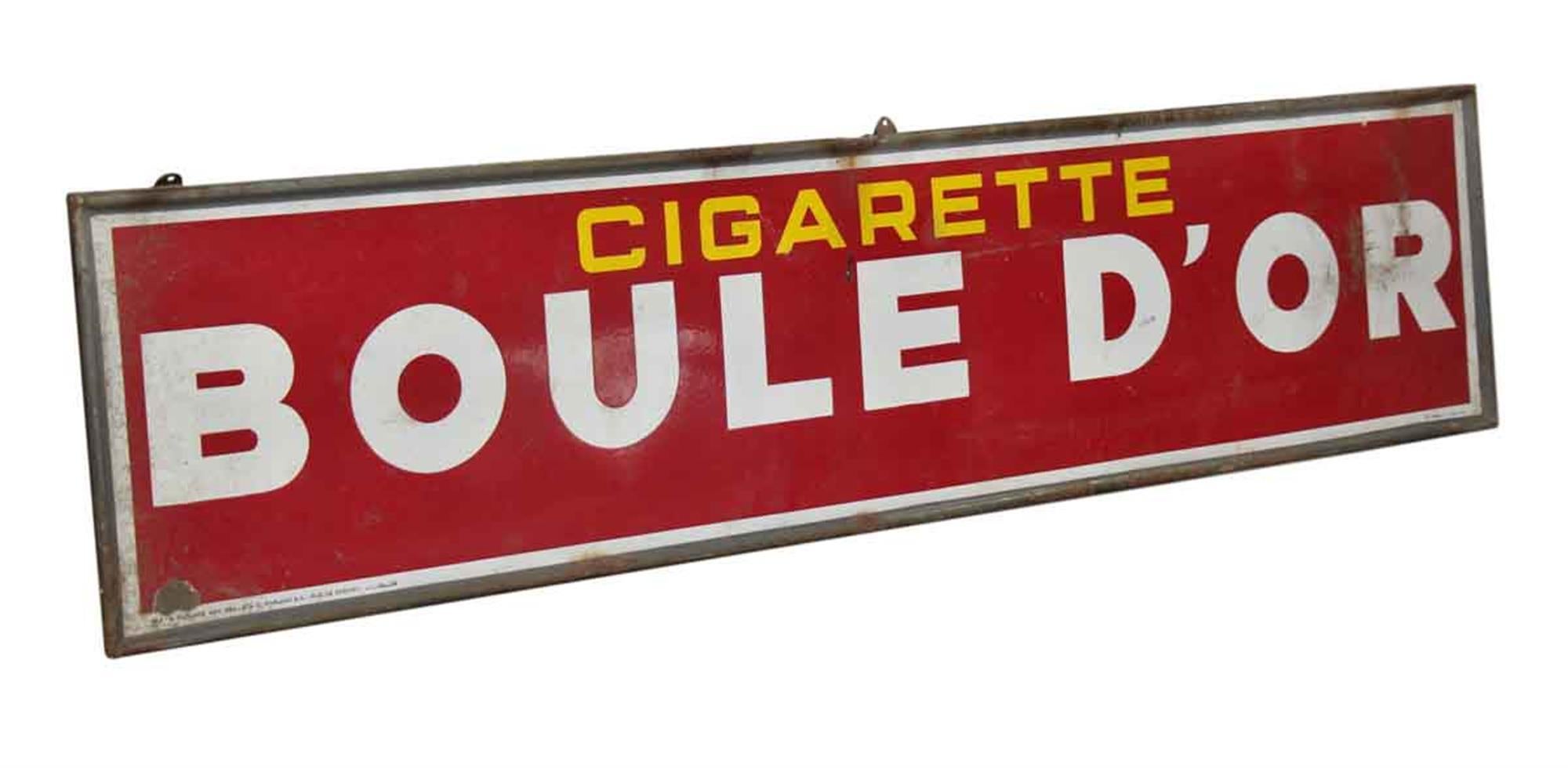 1950s French Boule D'or Cigarette sign. In English this sign reads Cigarette Golden Ball. The red, yellow and white just pop with color! This can be seen at our 302 Bowery location in Manhattan.