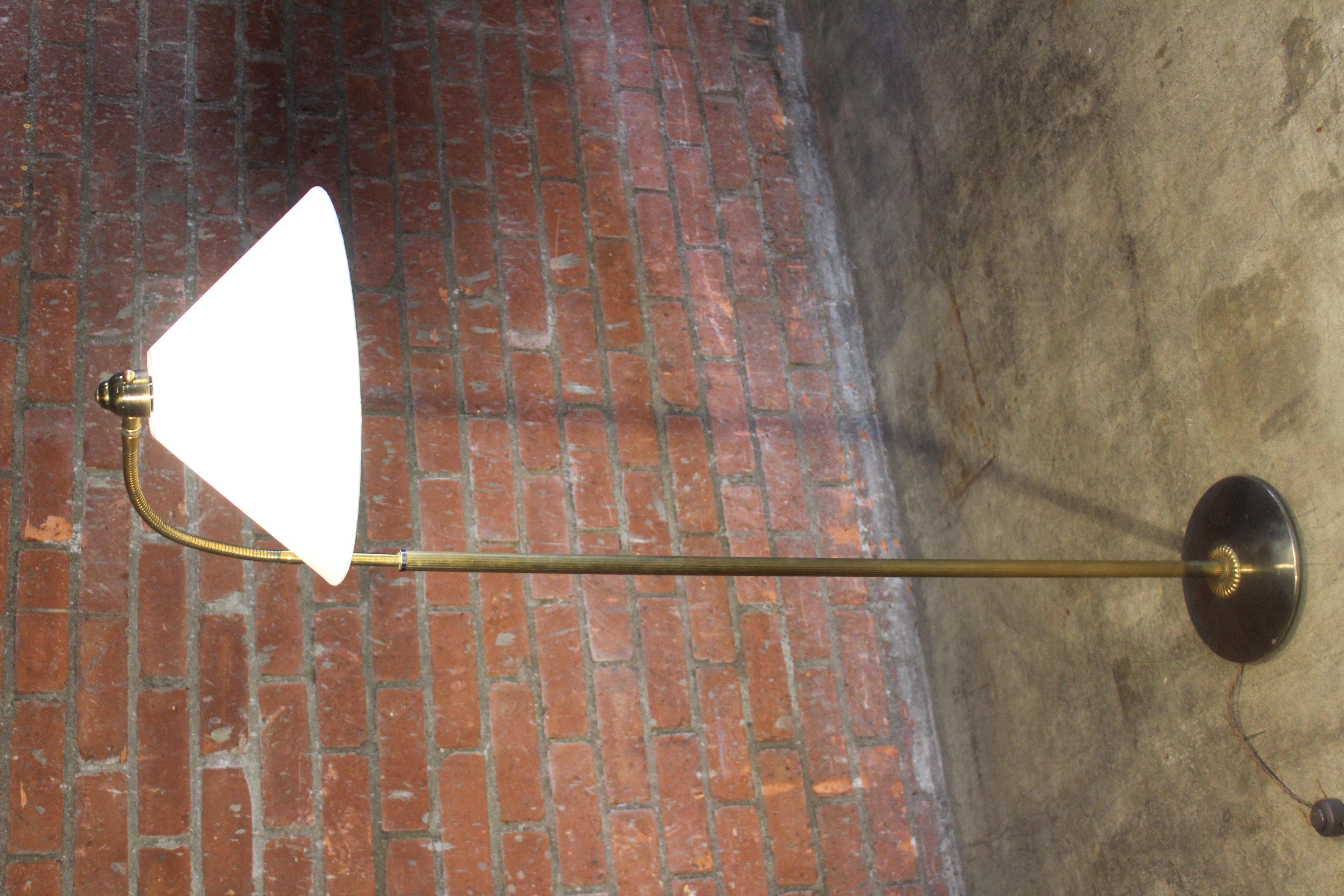 A vintage adjustable floor lamp from France, 1950s. Newly rewired and fitted with a custom made silk shade. Height adjustable as well.