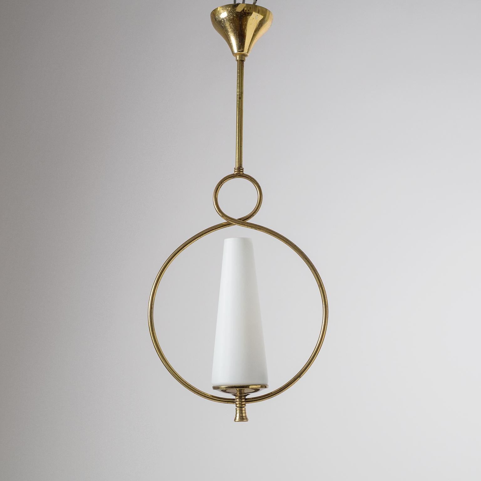 Charming French modernist brass pendant from the 1950s. The conical glass diffuser has a white inner casing and satin finish on the outside. Very nice original condition with slight patina on the brass. One brass and ceramic E14 socket with new