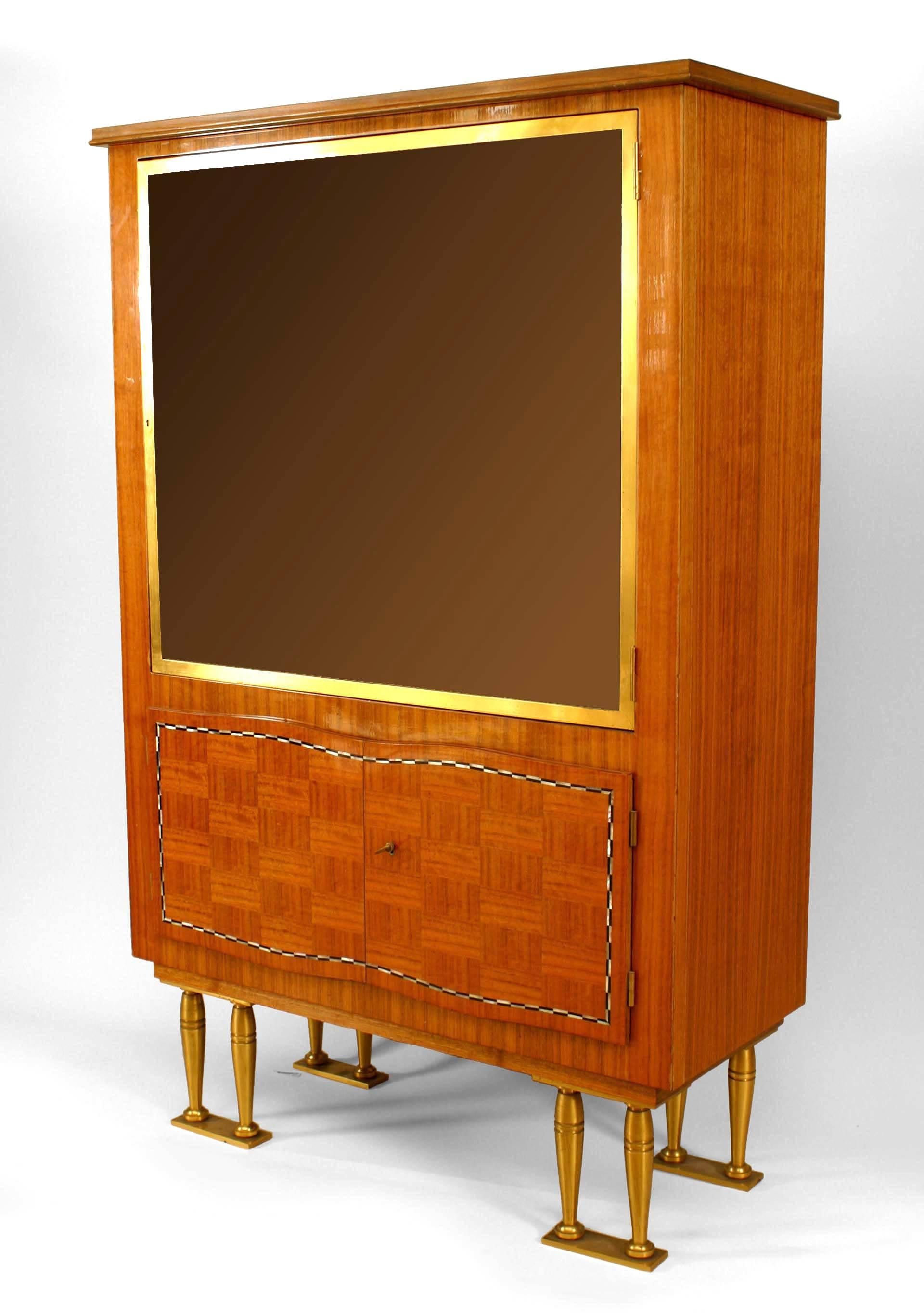 French Post-War Design (1950s) rosewood display cabinet with a Pair of marquetry inlaid doors trimmed with pearl & ebony over a large glass door on Paired bronze legs. (Jules Leleu).
 