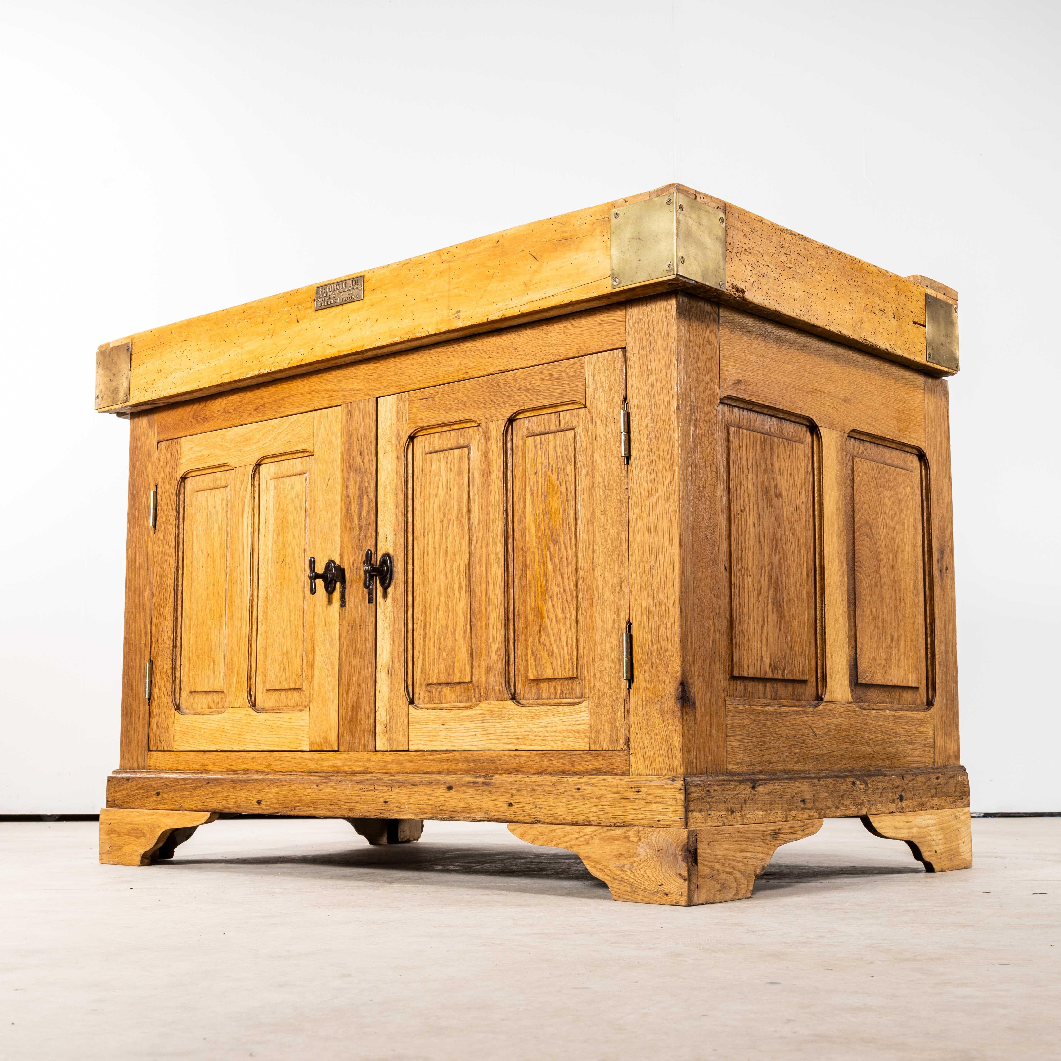 1950's French Butchers Cabinet With Butchers Block Top. 

Brilliant practical kitchen cabinet with two doors and heavy duty end grain butchers block top. Original throughout with original brass corner brackets and original handles. Made from solid