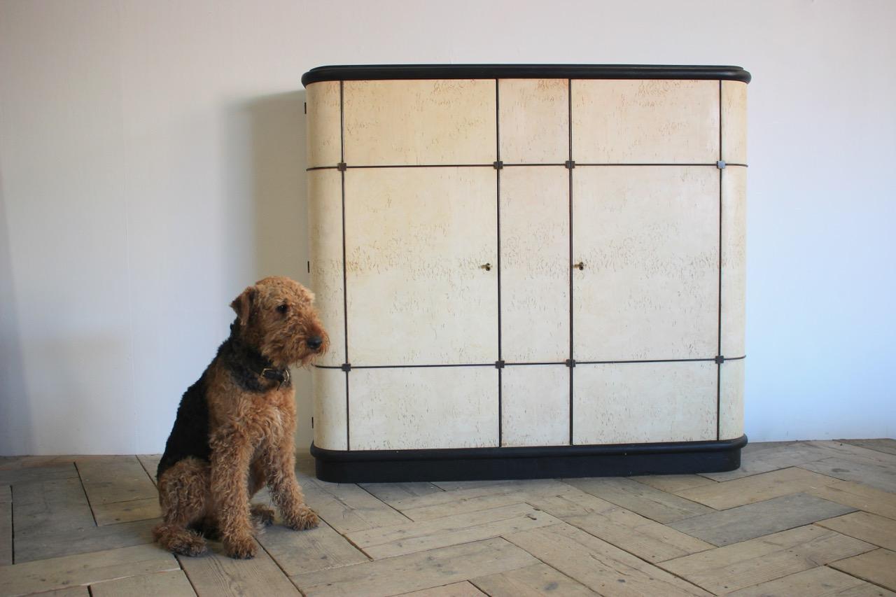 A very stylish and practical, circa 1950s French cabinet in bleached bird's-eye maple, offering plenty of storage.
 