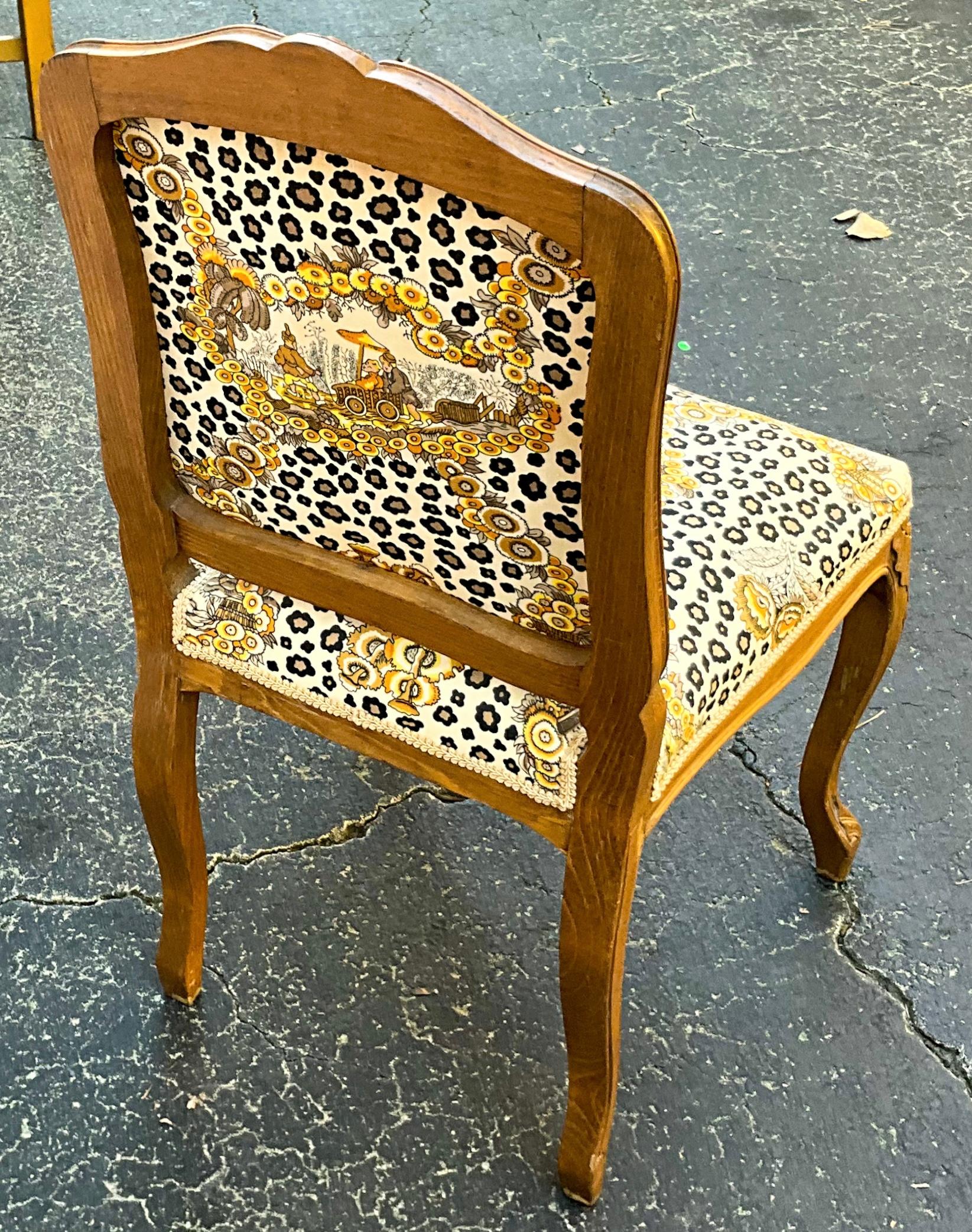 This is a carved French side chair that was upholstered in a 1970s Brunschwig & Fils leopard chinoiserie. It is in very good vintage condition.