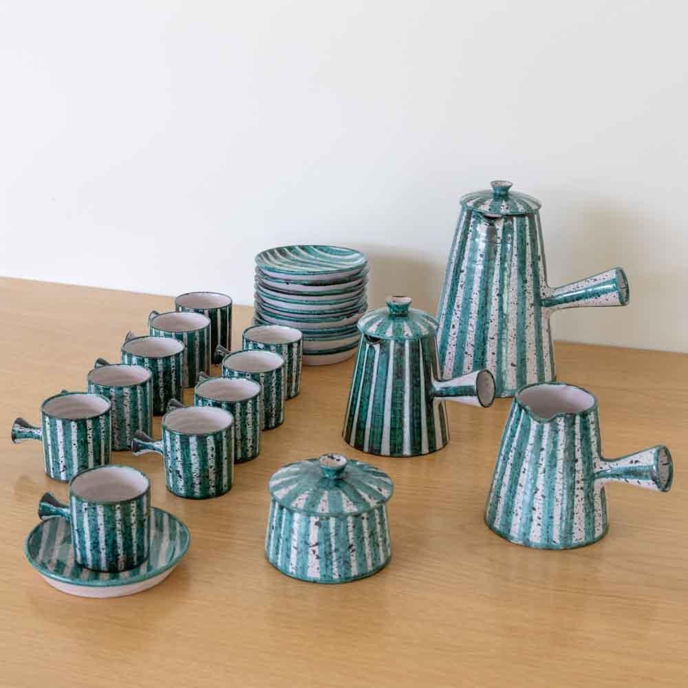 Incredible ceramic coffee set made by French ceramic maker Charles Voltz in Vallauris, 1950's. Set includes 1x large coffee pot with lid, 1x sugar bowl with lid, 1x creamer pot with lid, 1x creamer pot without lid, and 10x espresso cups with