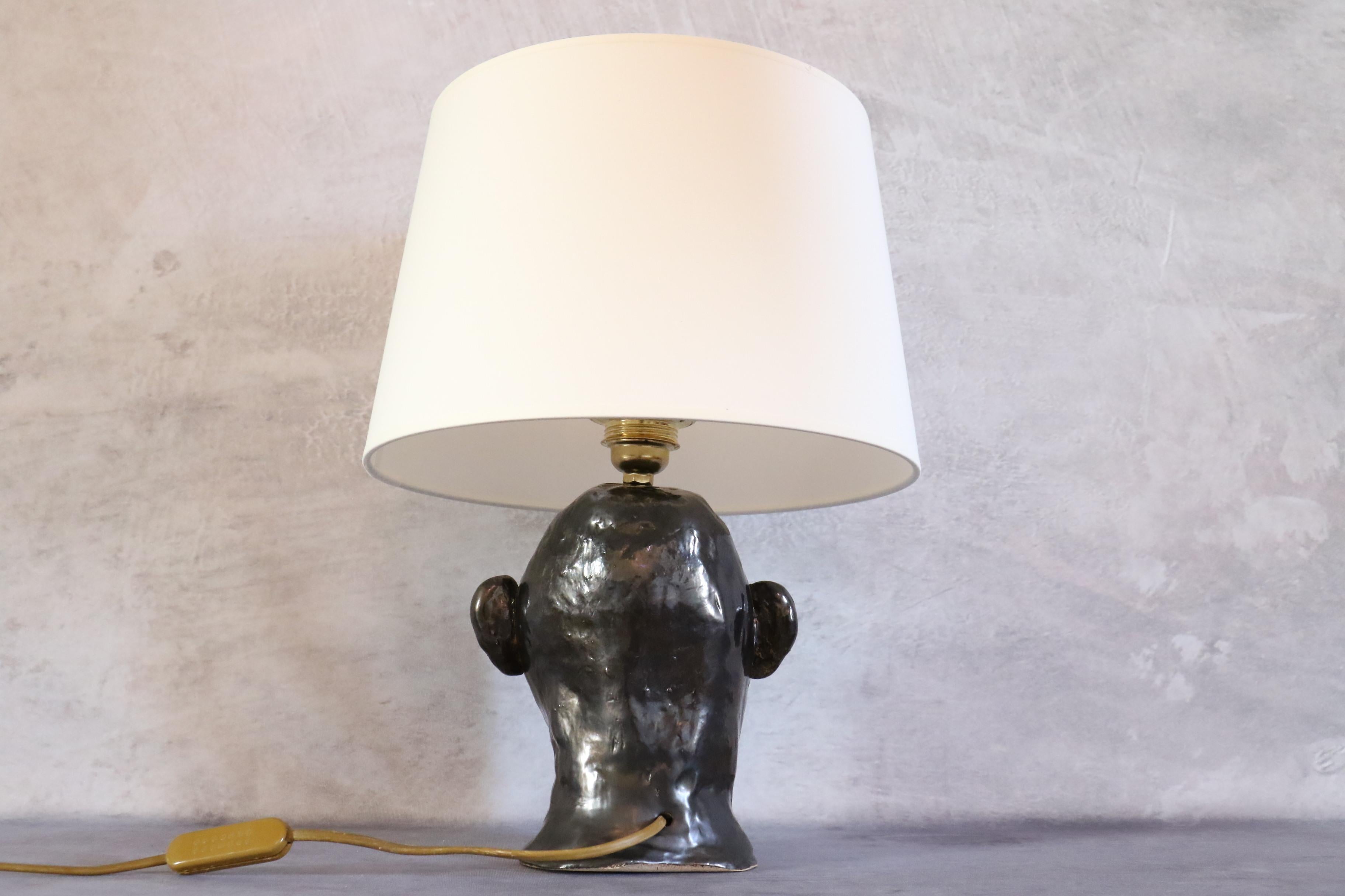 Enameled 1950s French ceramic lamp with face decoration in the style of Georges Jouve