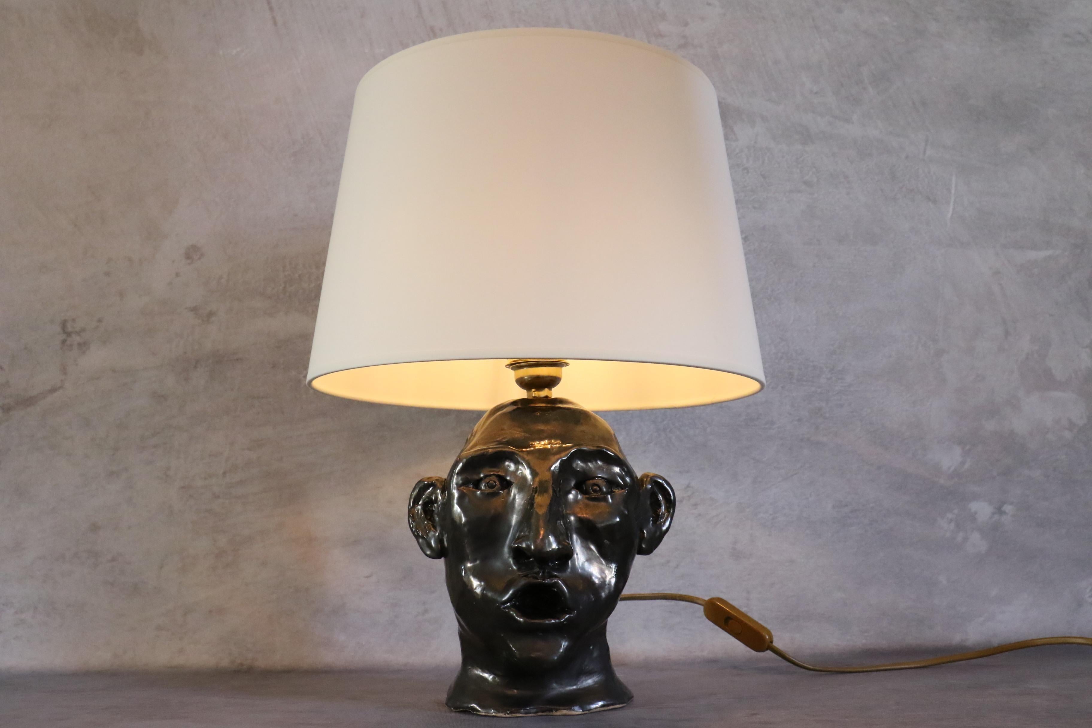 1950s French ceramic lamp with face decoration in the style of Georges Jouve In Good Condition In Camblanes et Meynac, FR