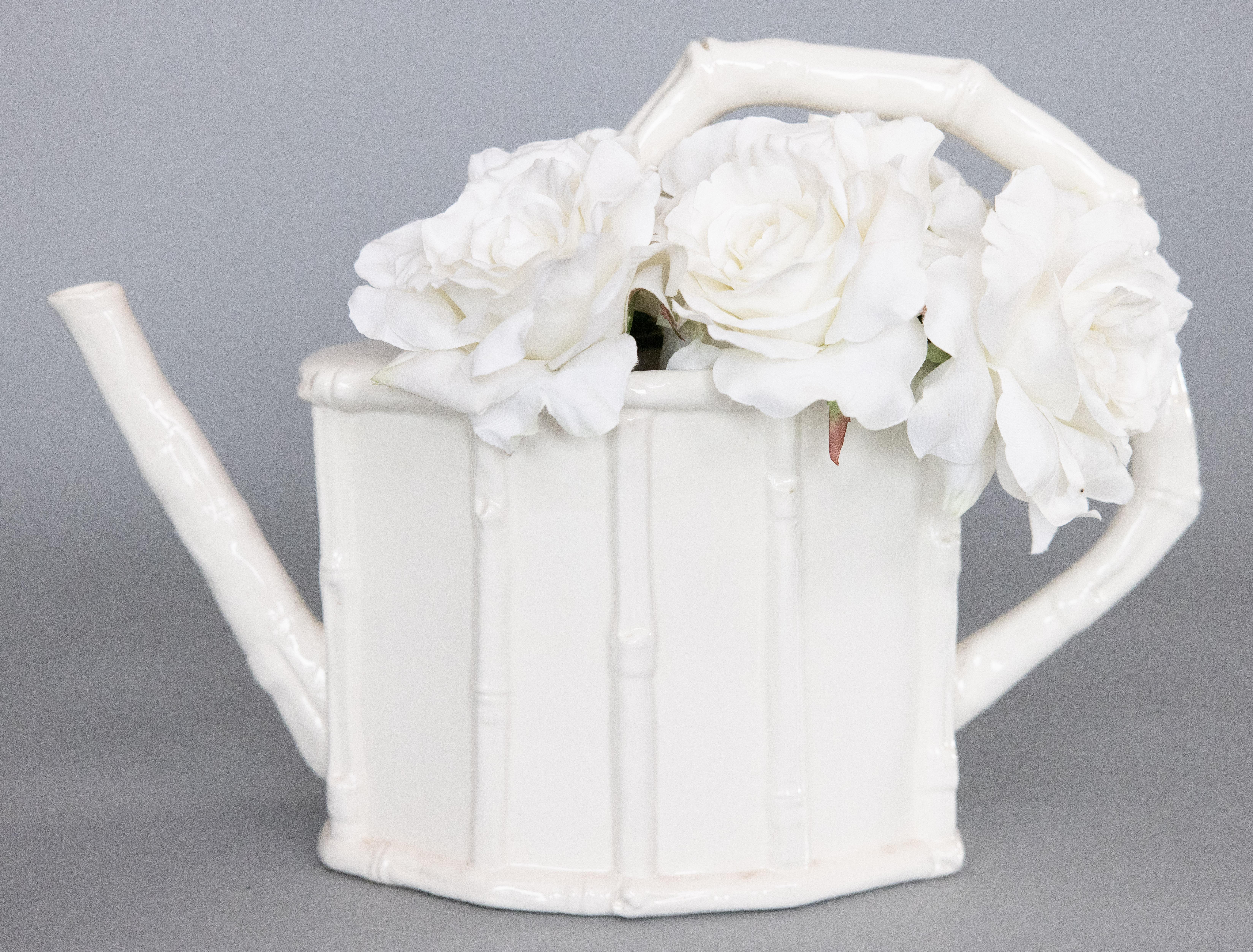 A fabulous vintage French Chinoiserie style white ironstone watering can or pitcher with a faux bamboo design, circa 1950. It has a sleek and stylish design, perfect for the modern home, and it displays beautifully, lovely with your favorite