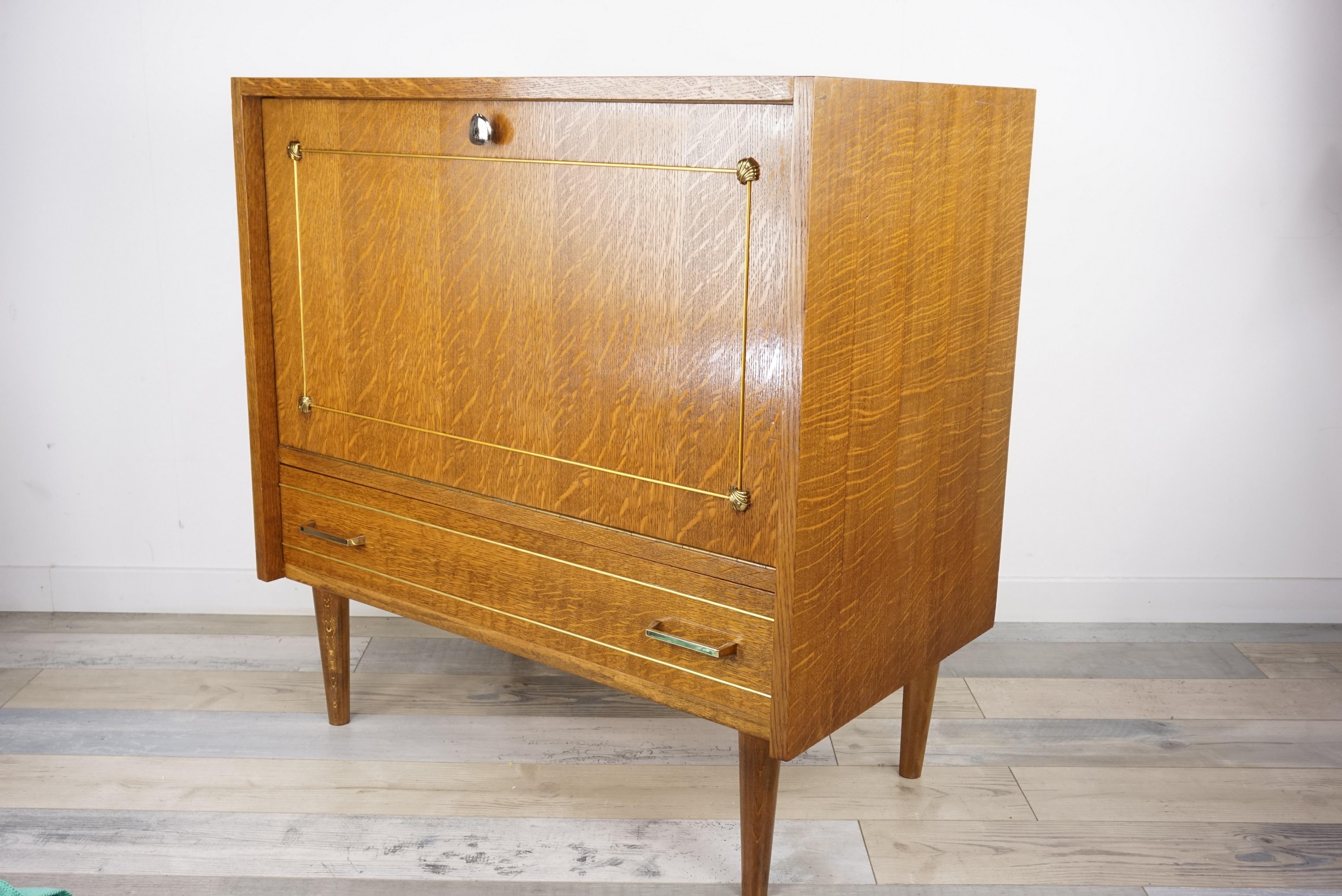 1950s -1960s, design wooden bar cabinet, adorable, practical and vintage look; it is composed of an oak structure called 
