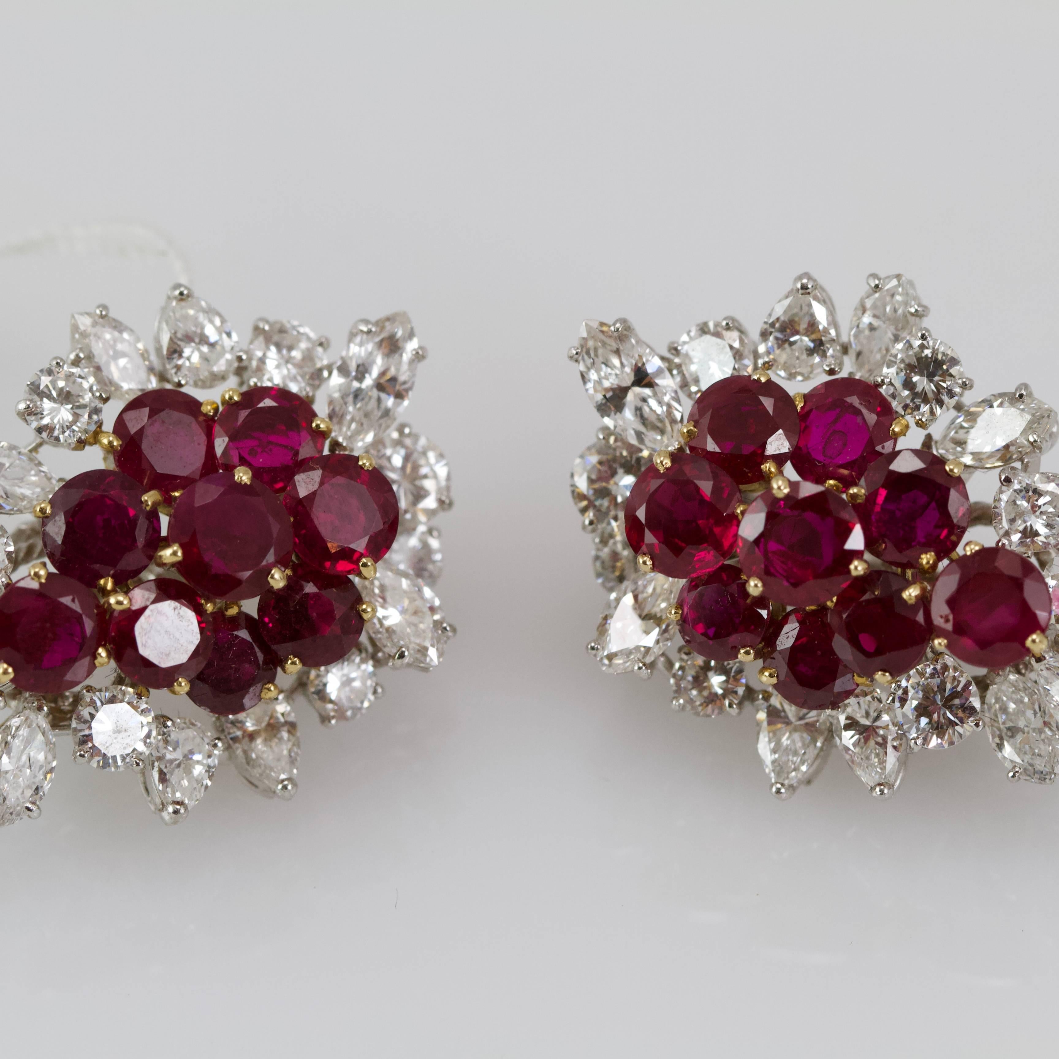 High jewelry french work. 
A pair of ear clips set with 18 round facetted rubies bordered by marquise, pear, and brillant shape diamonds. 
Total weight of diamonds almost 5 carats
Total weight of rubies almost 5 carats.
Rubies presents