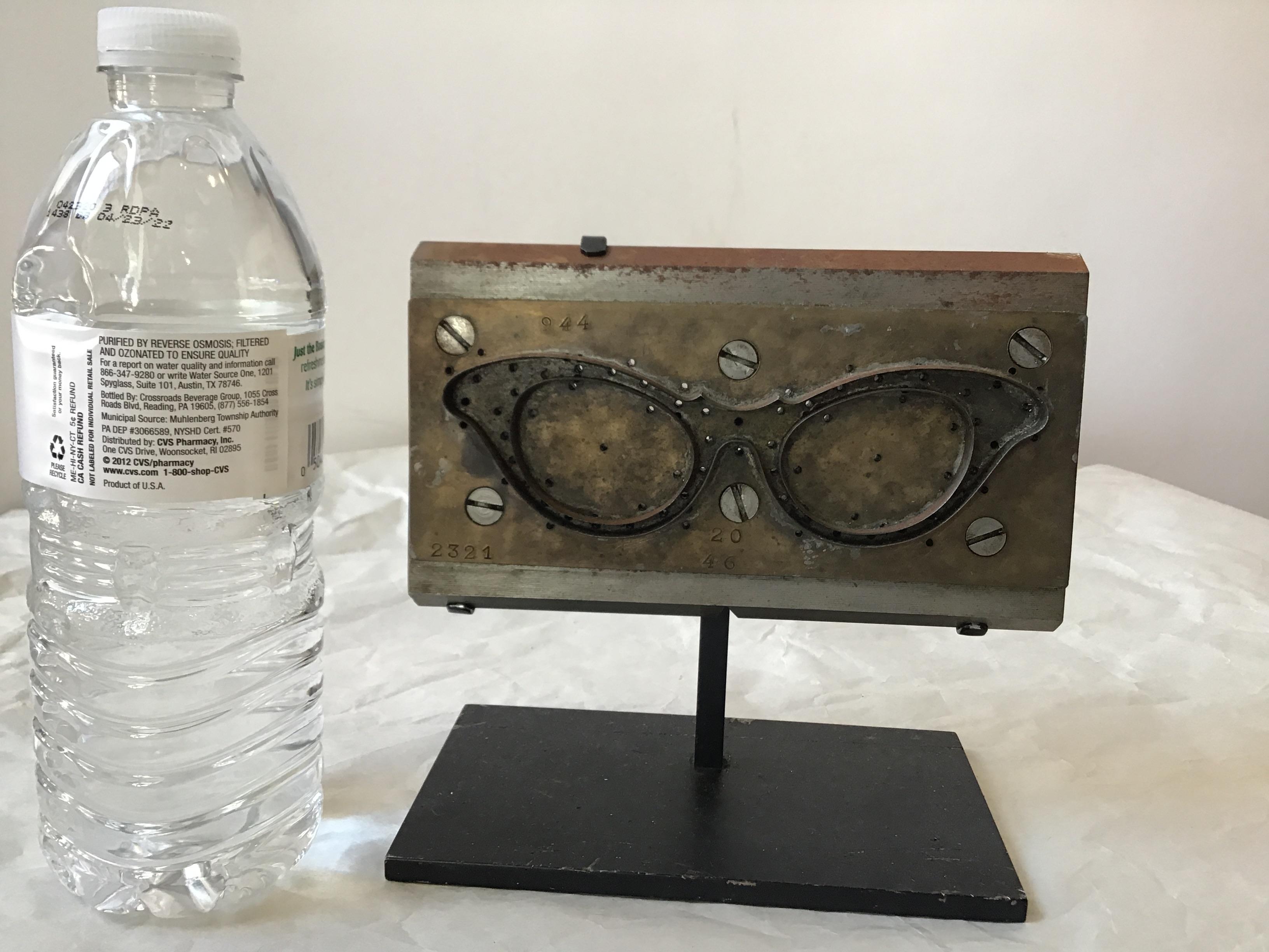 Actual 1950s French steel eyeglass mold. On custom iron base. From a Southampton, NY estate.