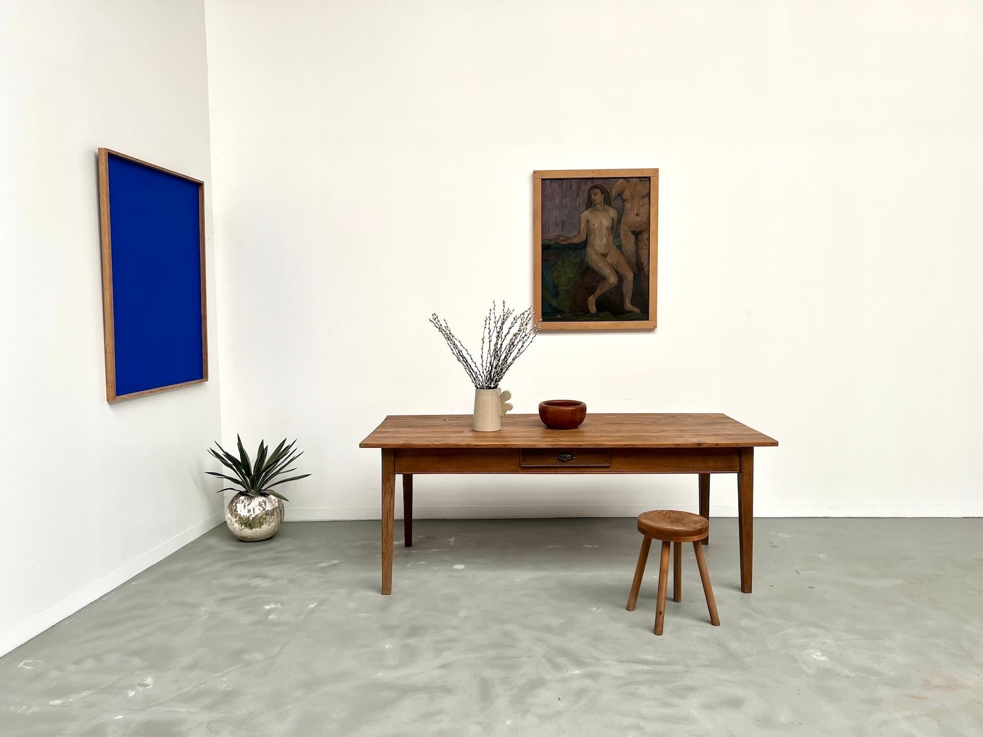 1950's French Farm Table 

Oak base, Pine top. Elegant 1950s French farm table with a refined silhouette.

The solid oak tapered legs ensure excellent stability, while the pine top has been fully restored and finished with a light satin varnish,