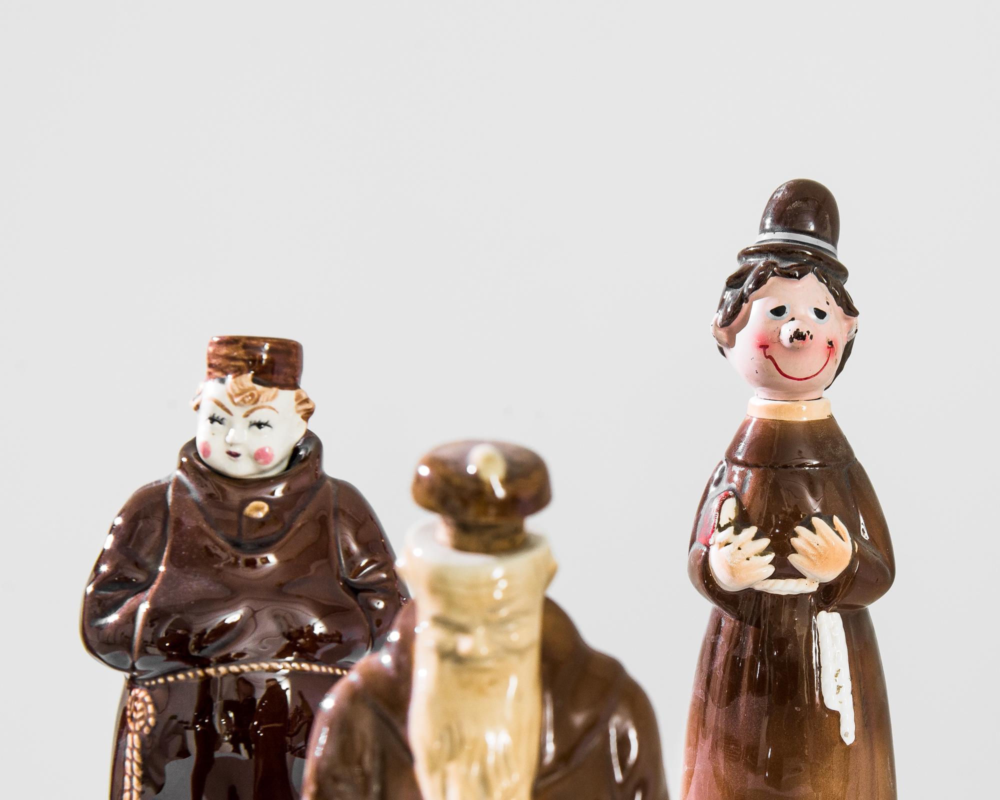 A selection of ceramic bottles from France, produced between the 1950s and 1970s. With their floor length brown cassocks cinched at thick waists with a rope, these friar themed vintage bottles bring with them a feeling of jovial piety and general