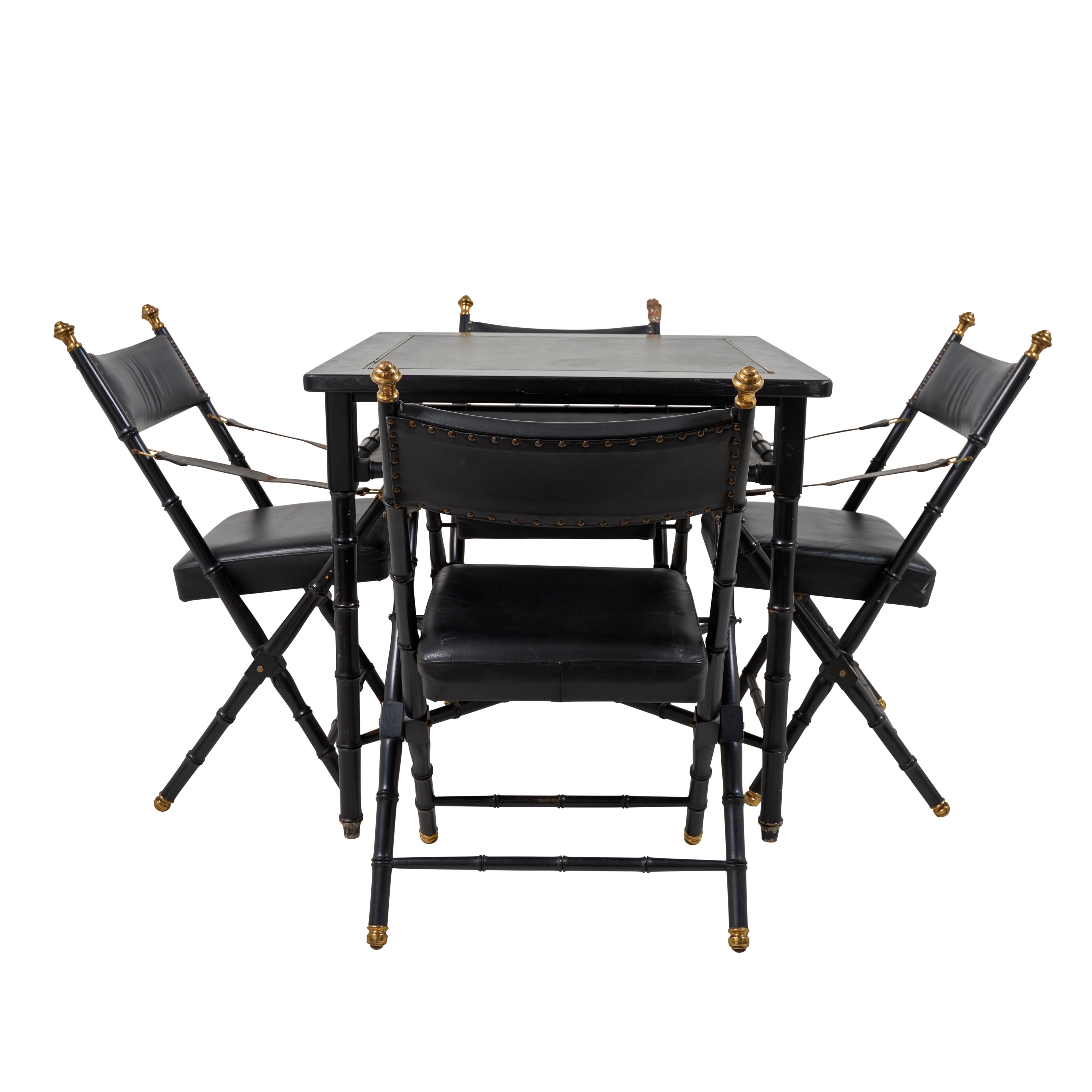 This listing includes four faux bamboo & leather campaign chairs and a game table. The chairs include brass detailing, and the game table has a reversable felt/leather top.

Since Schumacher was founded in 1889, our family-owned company has been