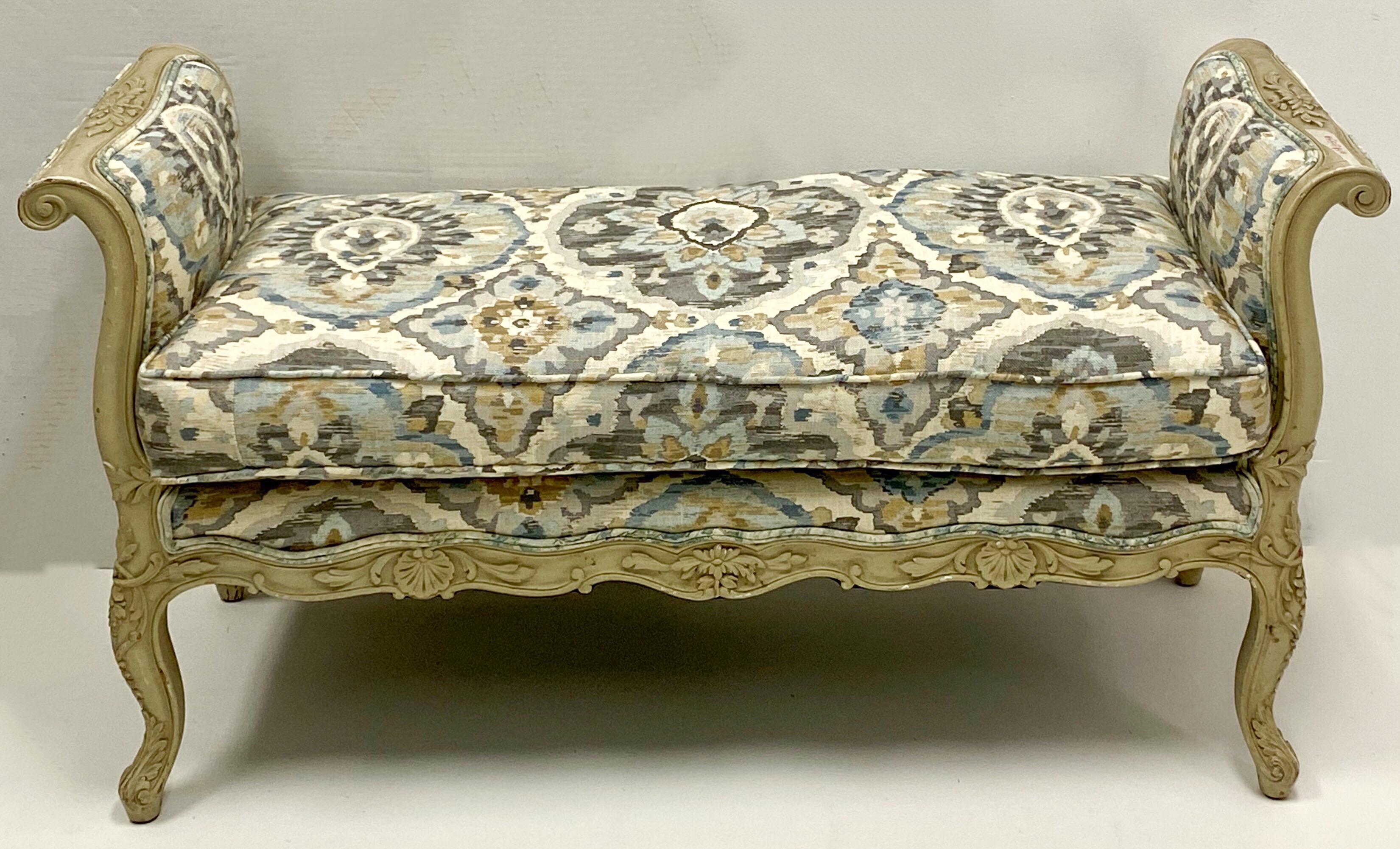 This is a good looking carved and painted French style bench. It is unmarked with a thick down cushion. The linen fabric appears to be a recent addition. I believe it dates to the 50s.