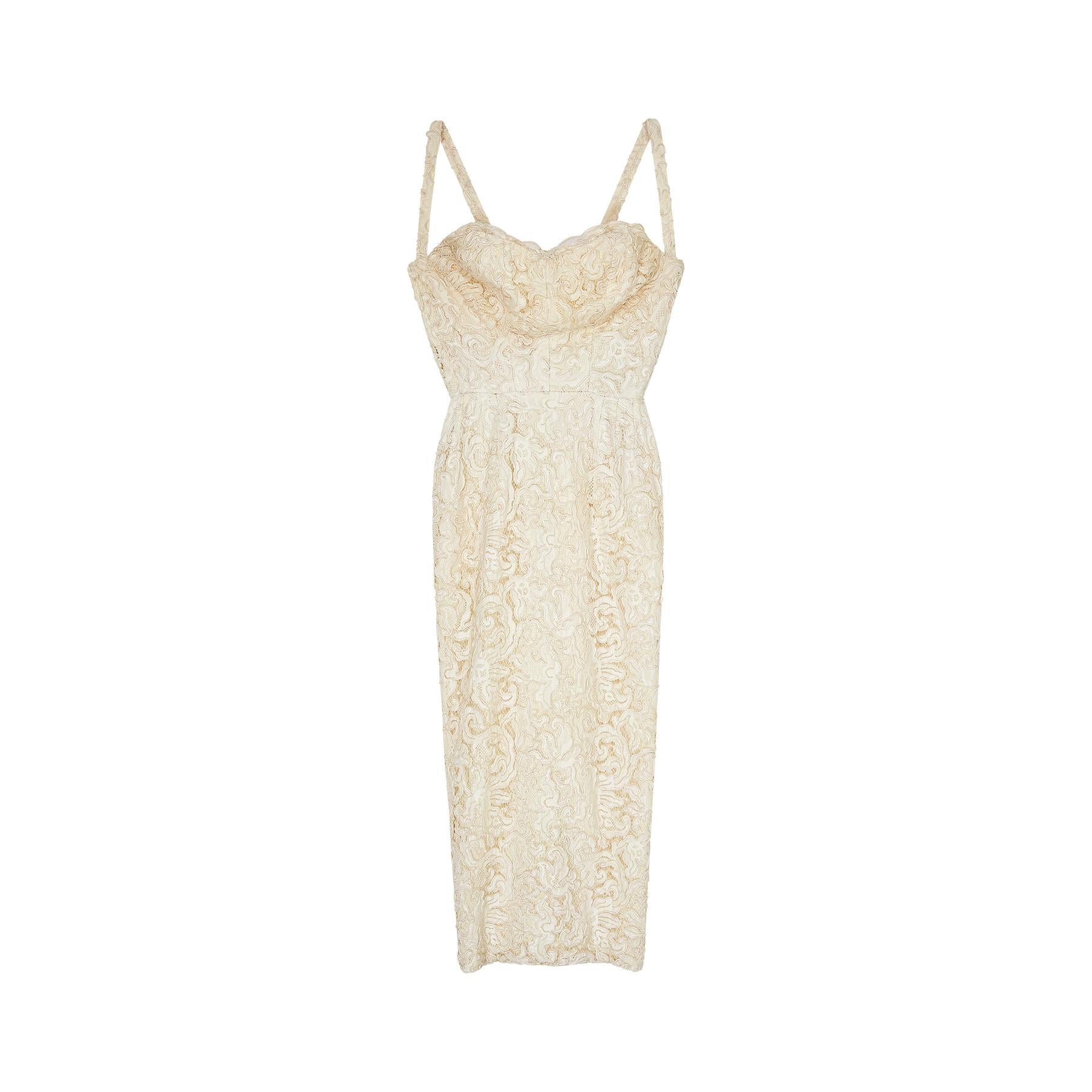 This French haute couture 1950s cream lace bustier dress hugs the female silhouette to perfection.   The lace is incredibly intricate and has a lovely thickness to it - a testament to its quality. The bust area features a sweetheart neckline and