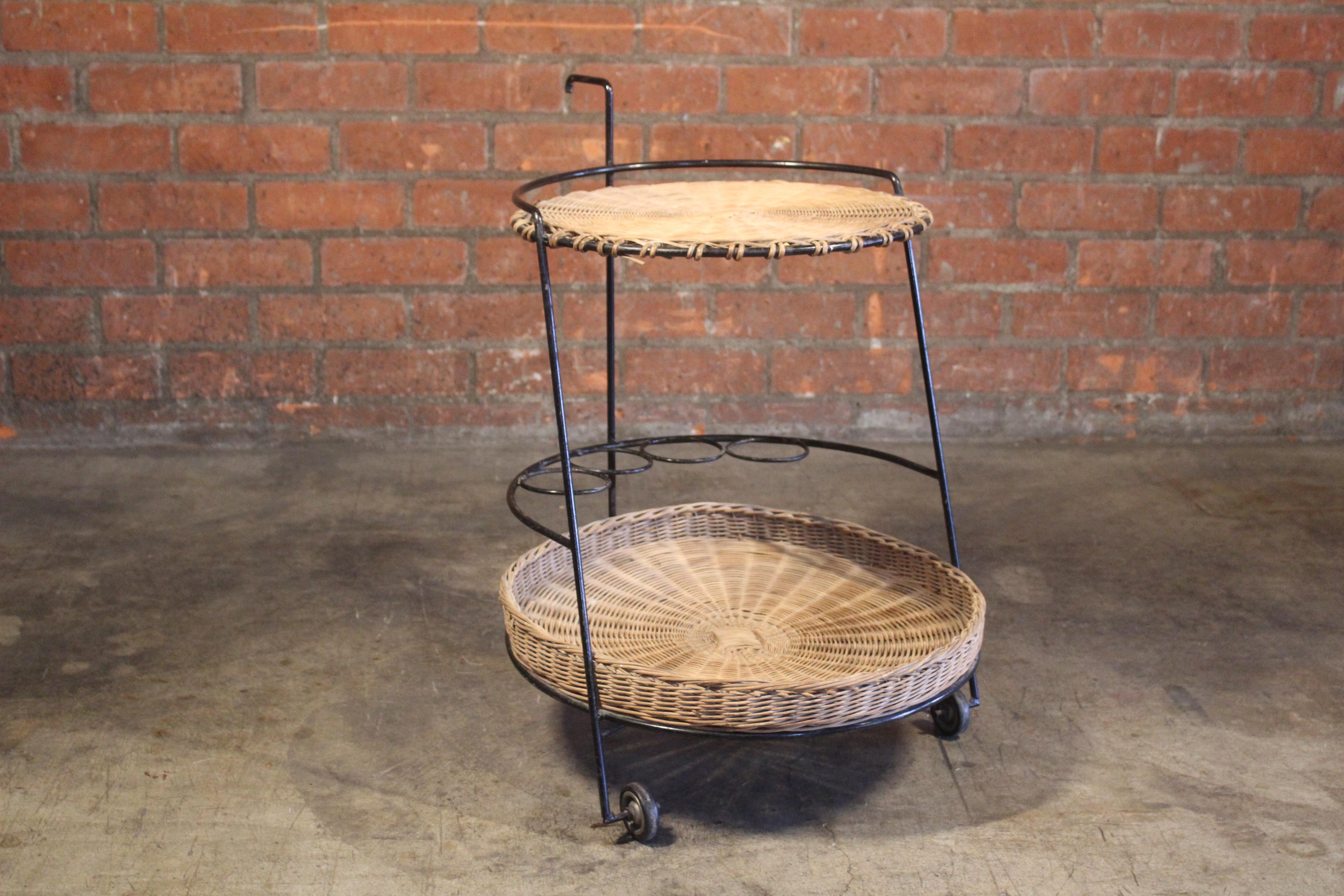 A vintage iron and wicker bar cart by Atelier Marolles, France, 1950s. In original condition with age appropriate patina.