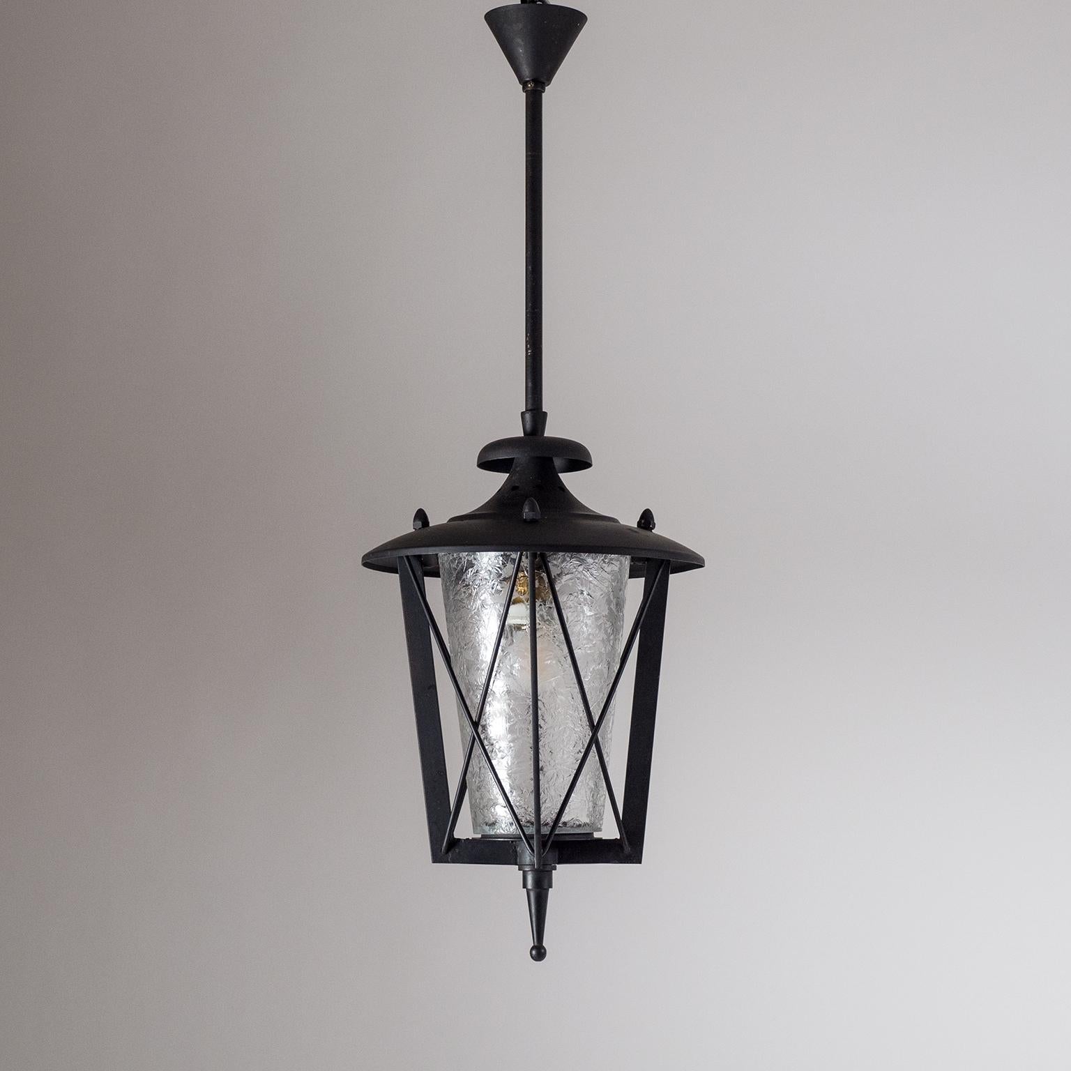 Very rare French outdoor lantern, circa 1950. Blackened steel Art Deco hardware with a chiseled glass diffuser in the style of Max Ingrand. This technique was pioneered by French Art Deco glass masters of the 1930s whereby the surface of the glass