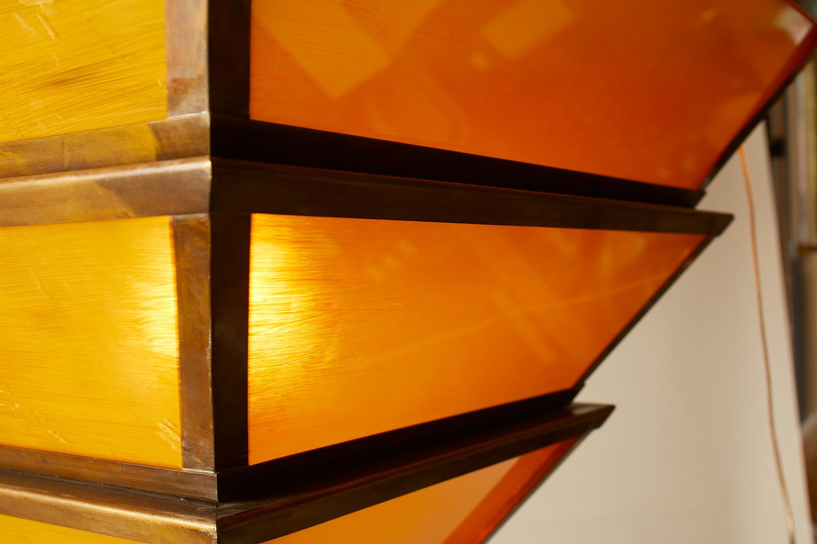 1950s French large-scale pendants with bronze and amber painted glass.