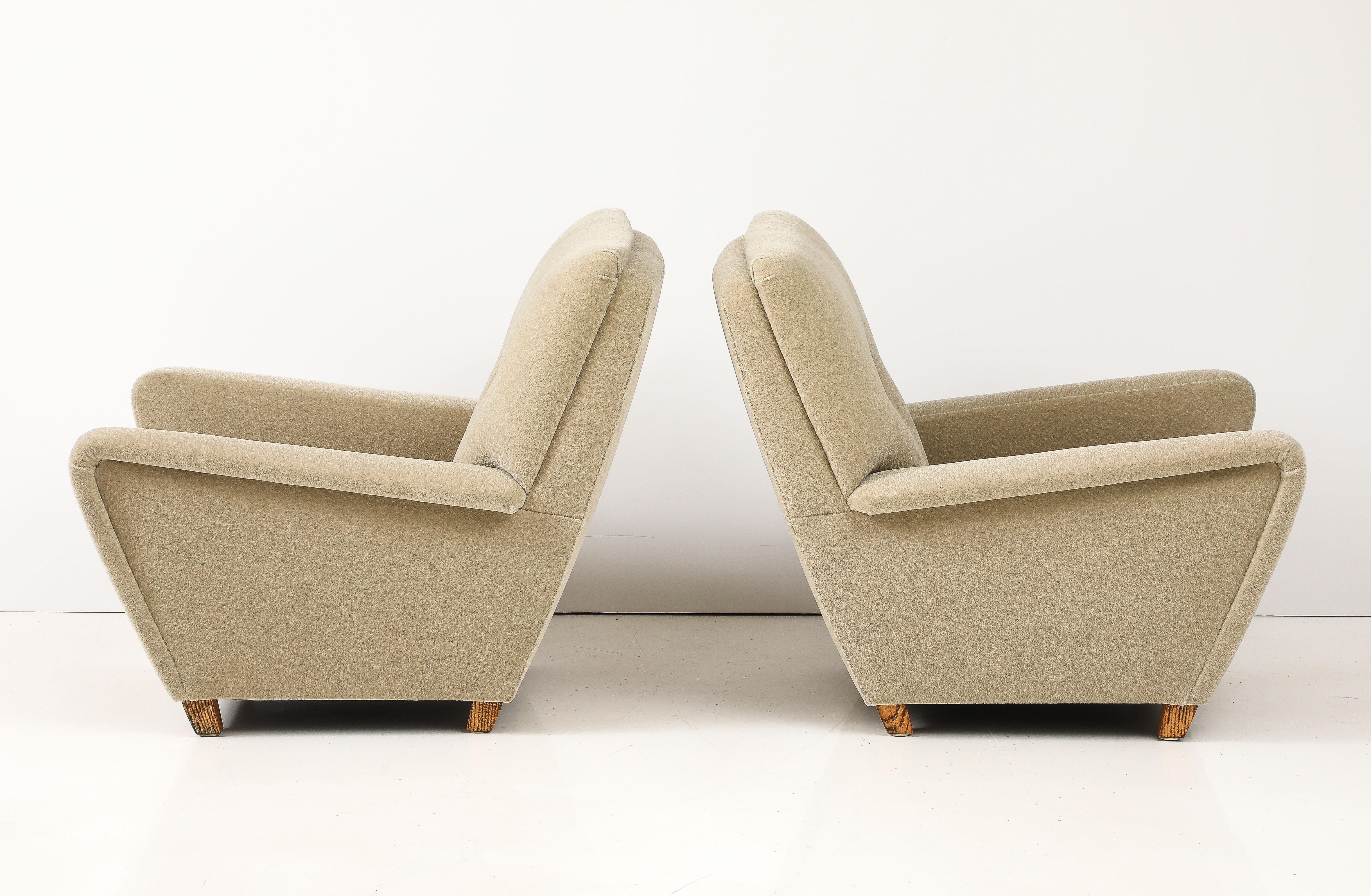 Amazing pair of 1950's French Lounge chairs, the chairs have been reupholstered in Donghia Mohair fabric, the chairs are well made and very heavy.
