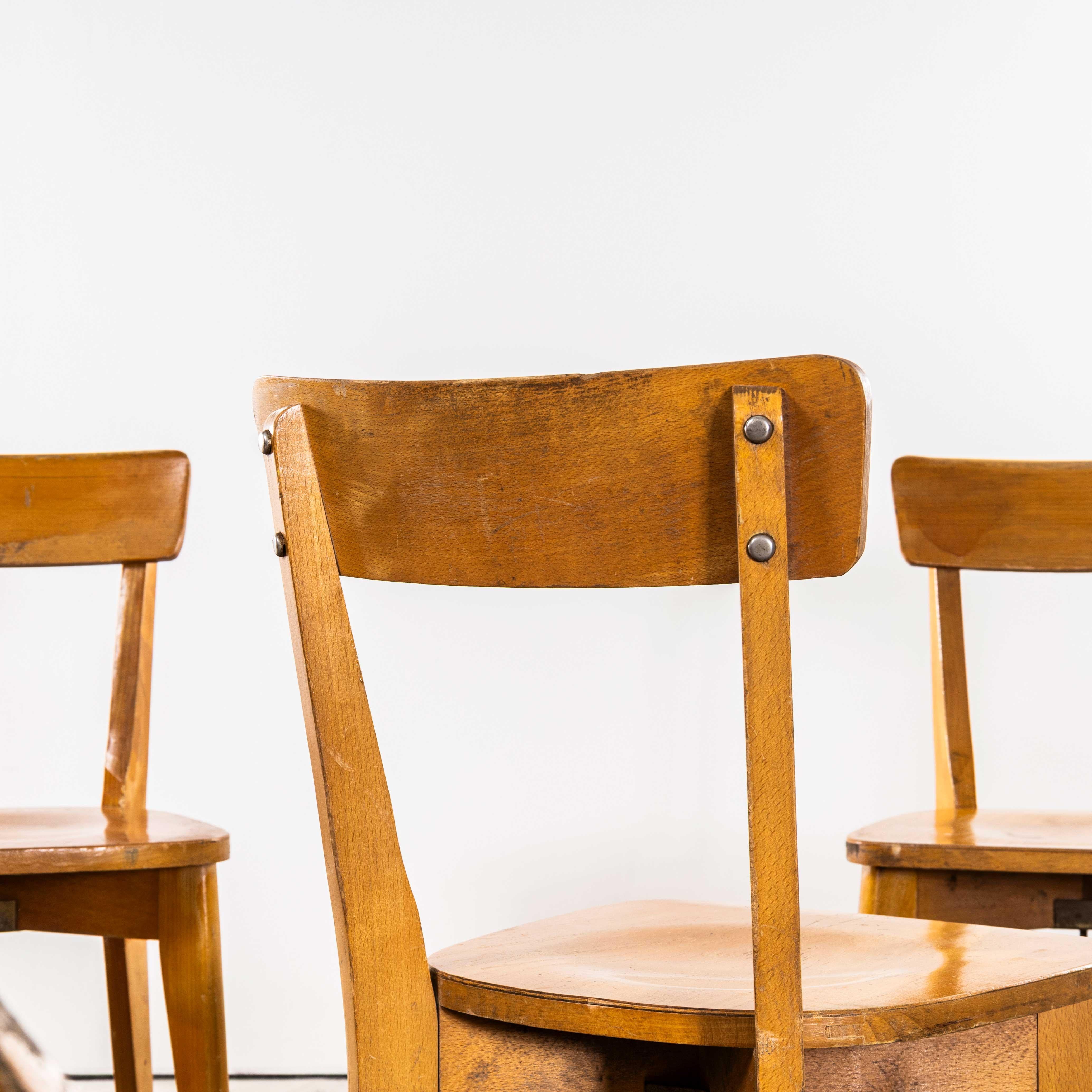 Sillas de comedor francesas Luterma de madera curvada con base en cruz de los años 50 mediados del siglo XX en venta