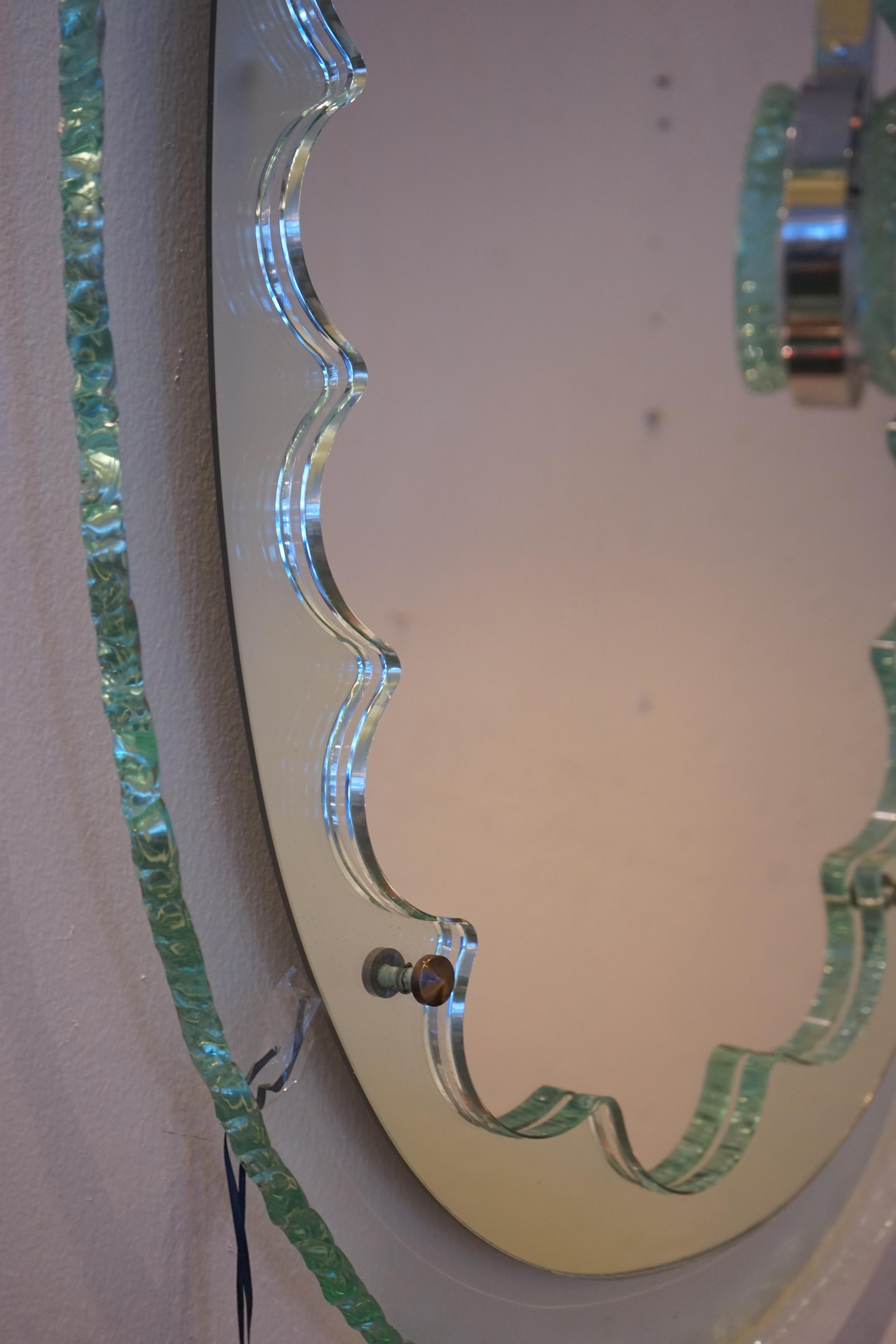 1950s French Max Ingrand inspired chiseled glass and scalloped design oval mirror.