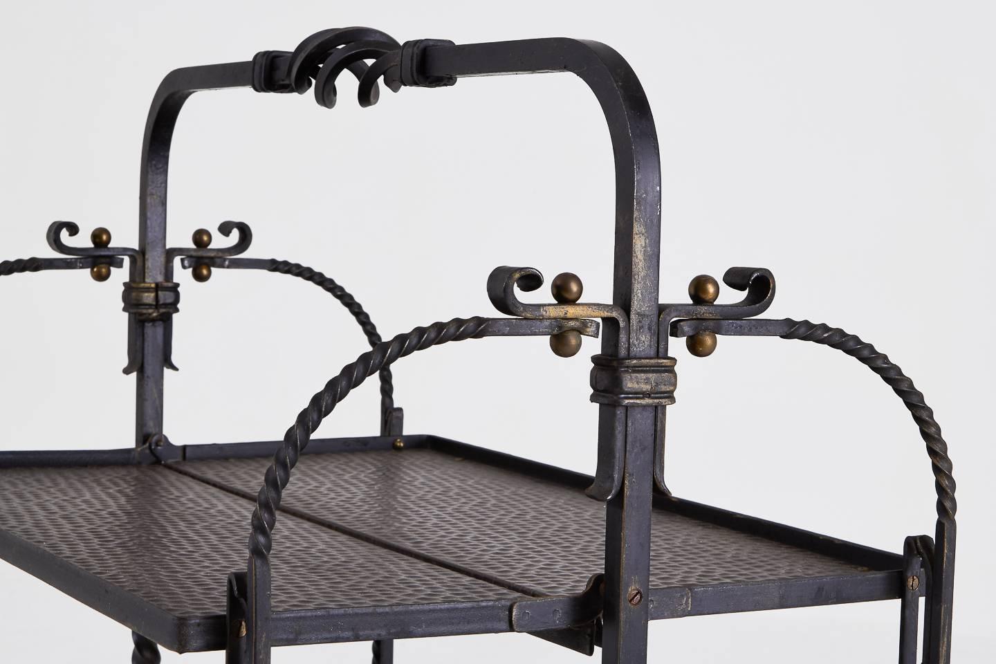 Good quality 1950s French wrought iron and brass folding metamorphic trolley.
 