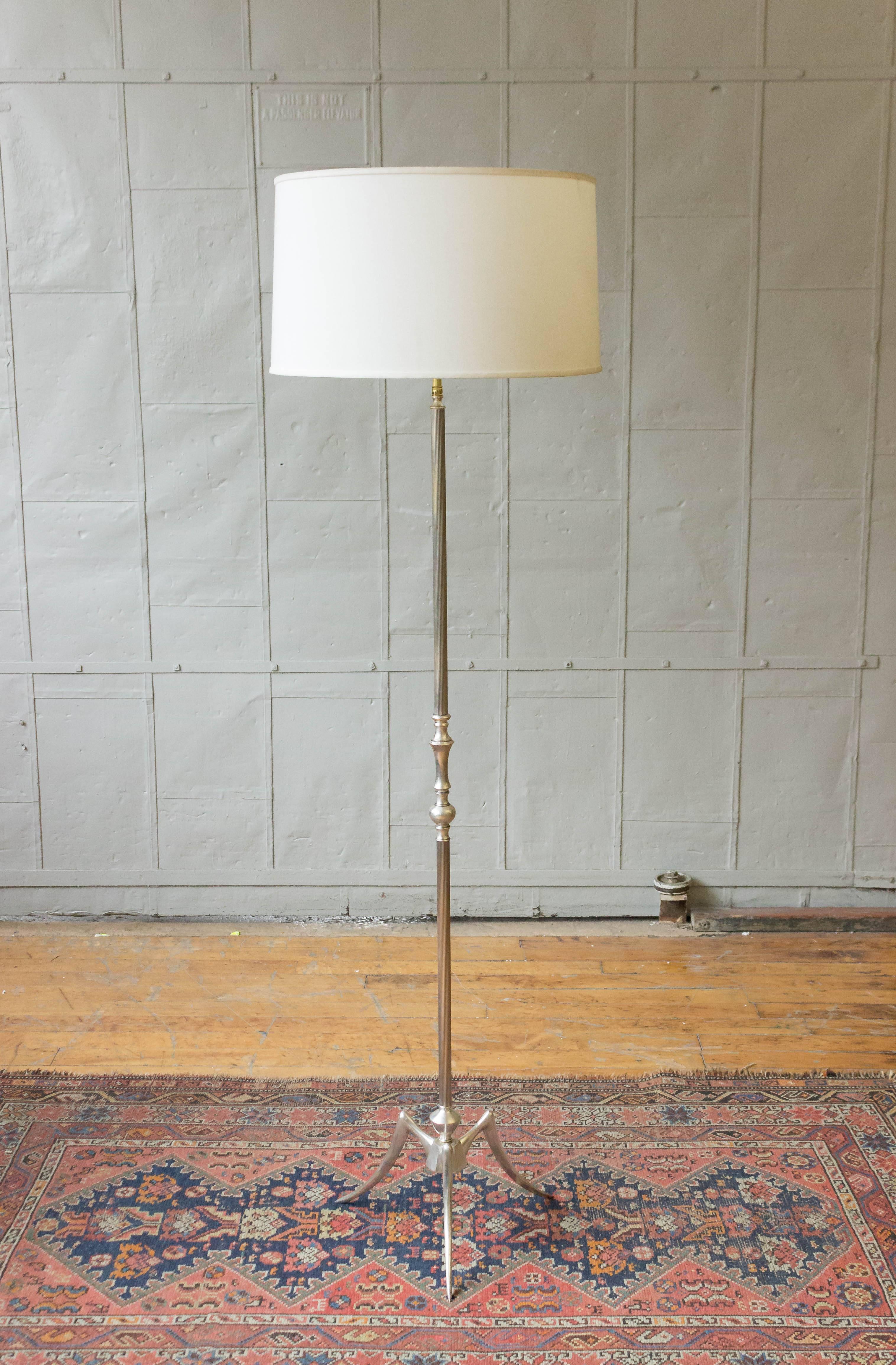 Mid Century silver plated floor lamp on tripod base with fluted stem.

Price includes polishing or plating and new wiring. Please allow 2 to 3 weeks for completion. Not sold with shade (photographed with 10 inch H x 18 inch Diameter shade). 