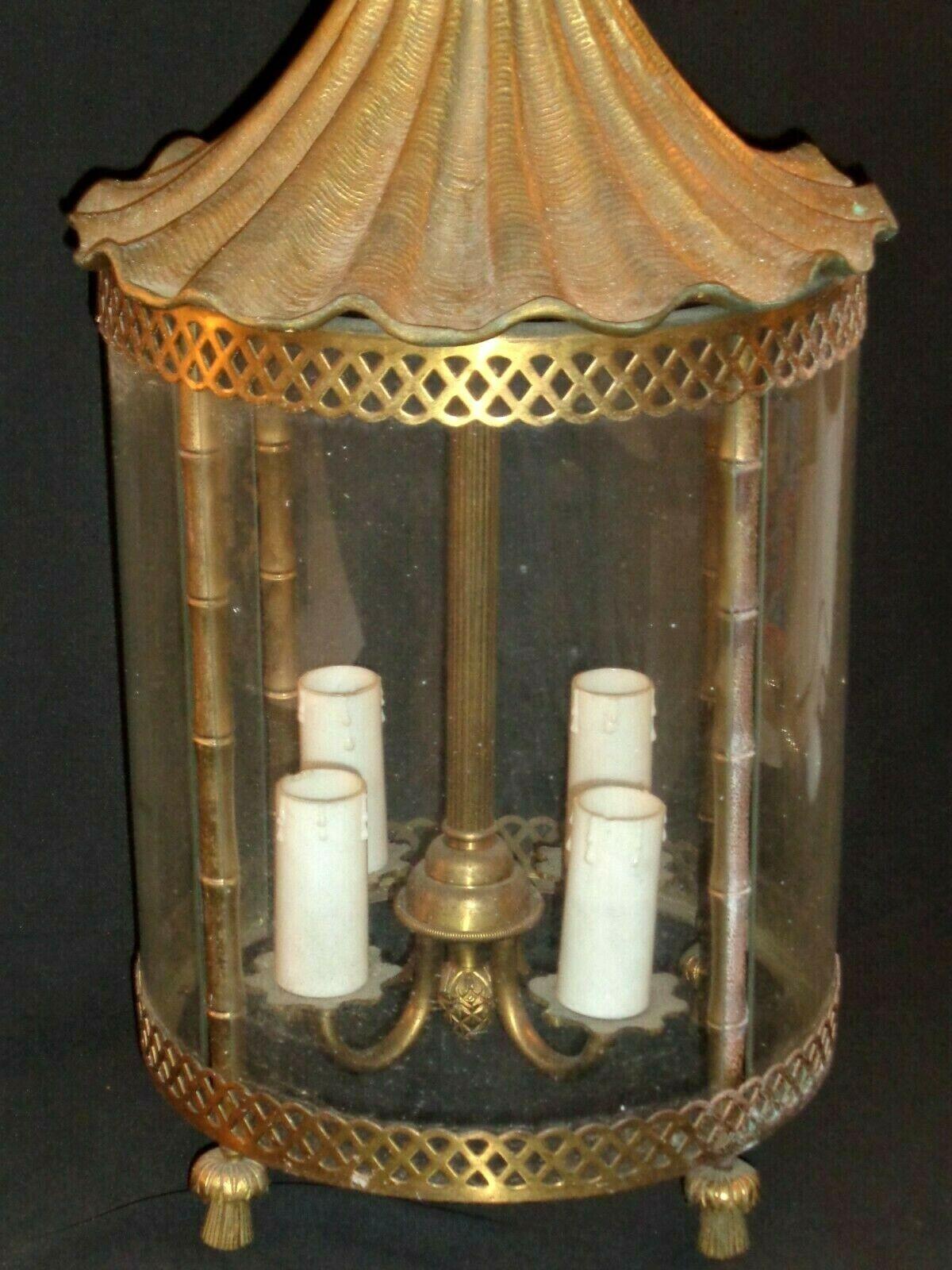 1950s Grand French Gilt Bronze 3 Light Pagoda style Lantern. One of the panes of glass is not present. French Chateau find. Manufactured by Maison Bagues. We could remove the other panes of glass and have this lantern open style with no glass.
