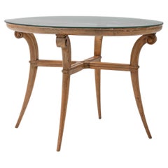 1950s French Neoclassical Round Glass-Top Table With Curved Wooden Legs