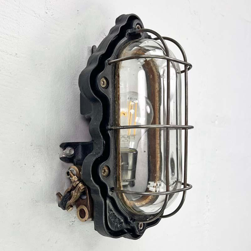 Iron 1950's French Oval Black Cast Steel Bulkhead Light by Perfeclair of Paris For Sale