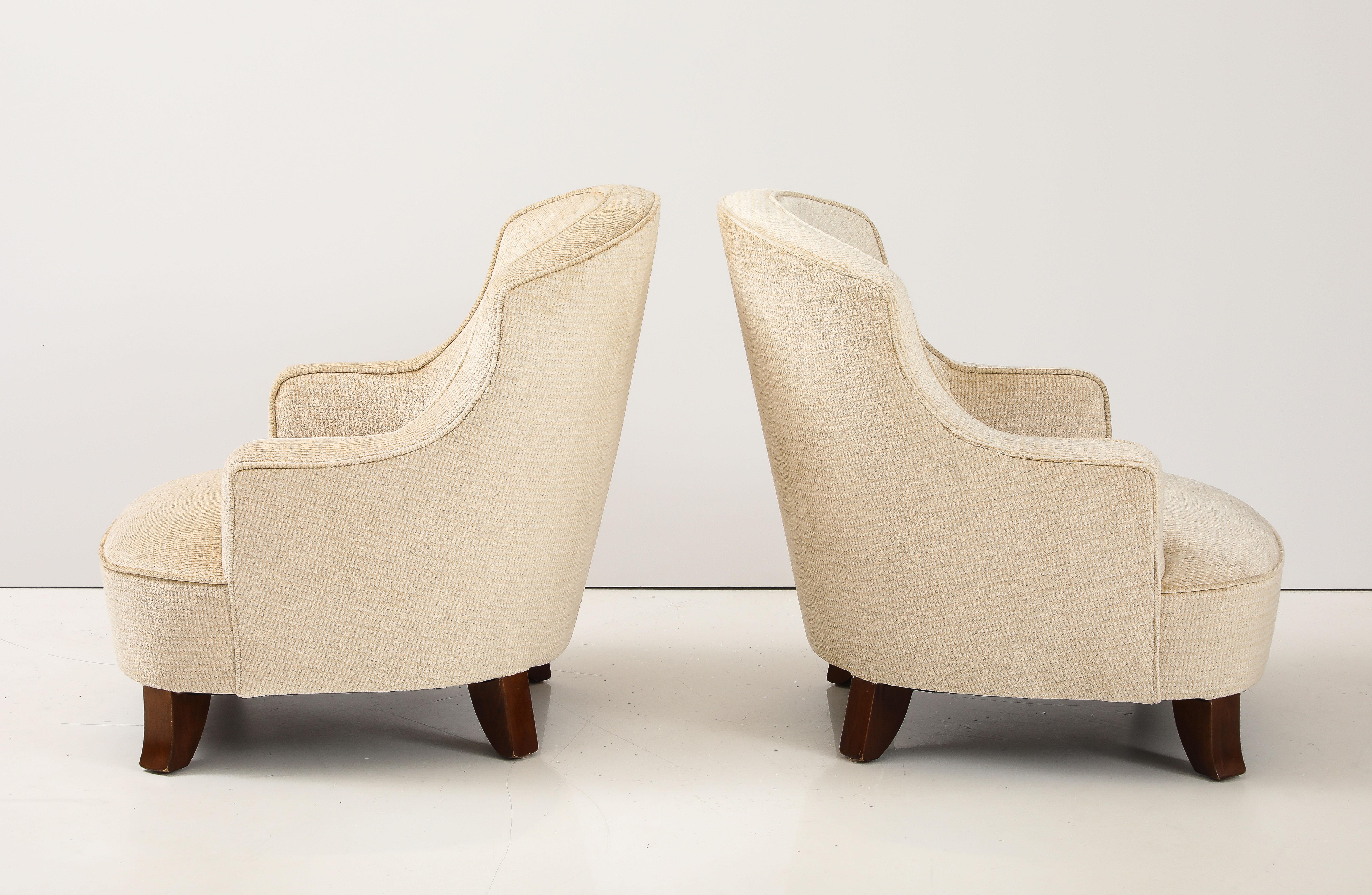 Beautiful pair of 1950's petite French lounge chairs newly re-upholstered in Chenille fabric, with minor wear and patina due to age and use, the chairs are well made and very heavy,