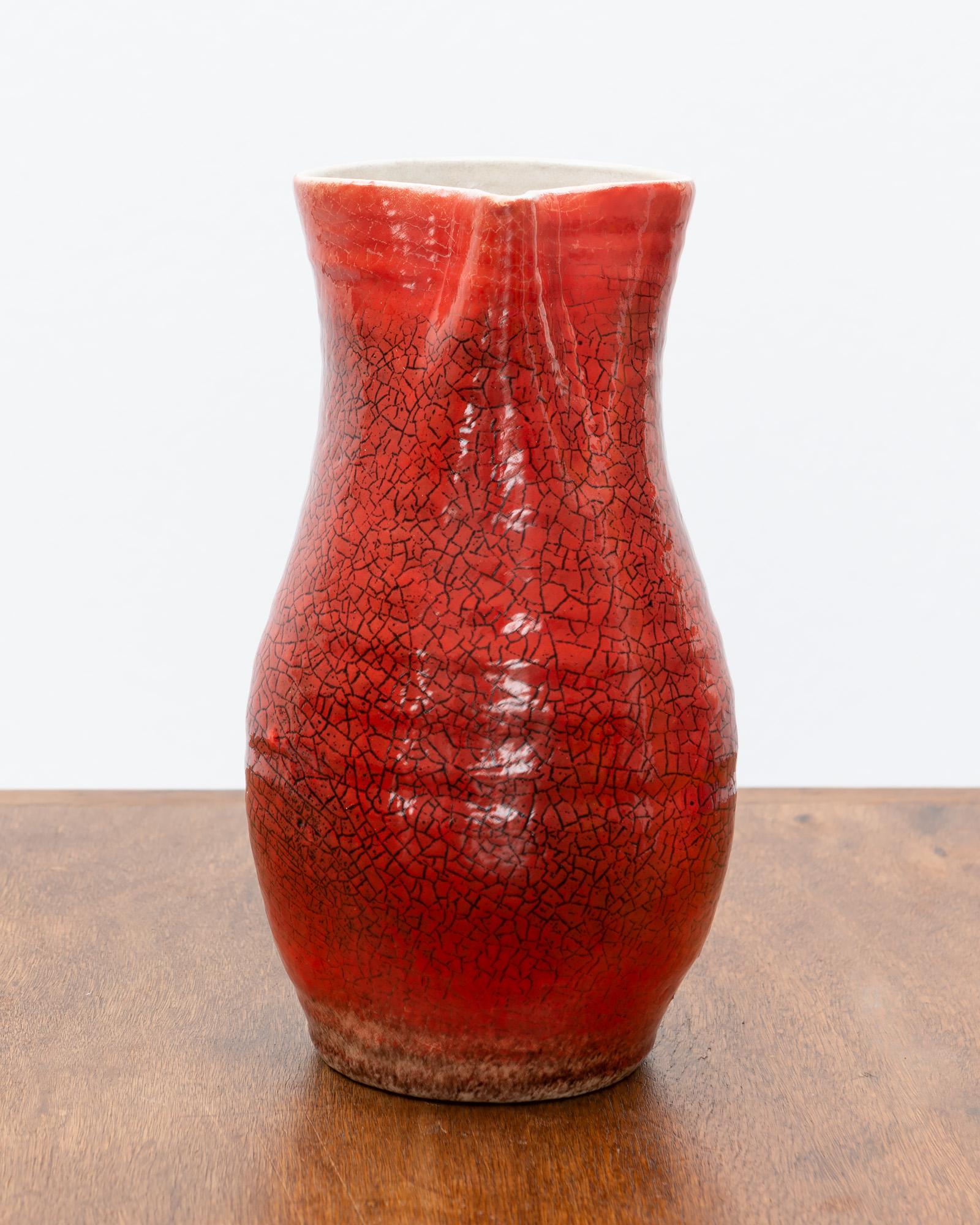 Stunning Accolay pitcher in a Classic French form with a gorgeous red glaze. France, 1950s.
