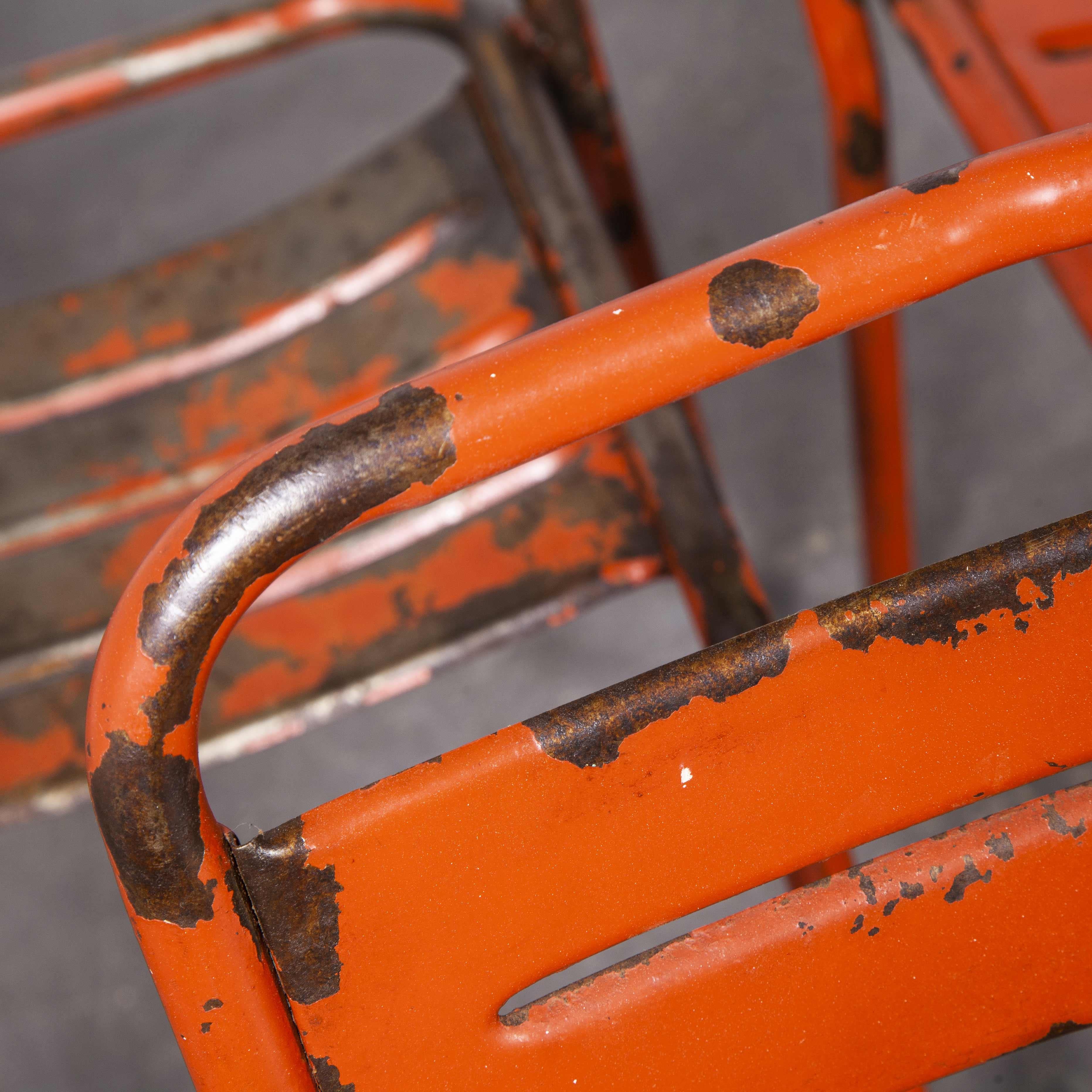 1950's French red metal stacking outdoor chairs, set of five

1950's French red metal stacking outdoor chairs, set of five. Reminiscent of Tolix but not made by Tolix, this chair was industrially produced in the 1950’s by various workshops in