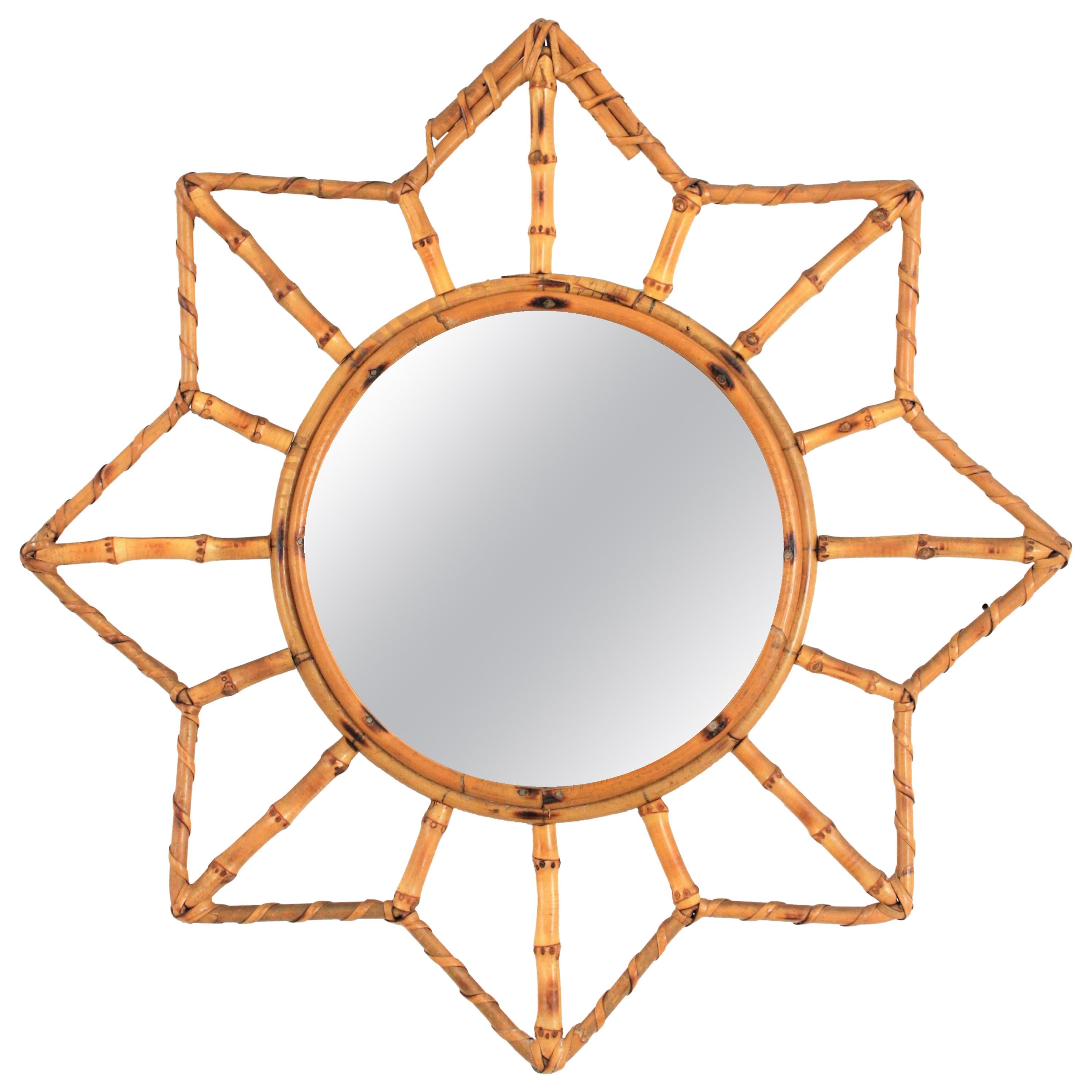 A lovely Mid-Century Modern handcrafted bamboo and rattan mirror with star shape and all the taste of the Mediterranean French Riviera taste.
France, 1950-1960.
Place it alone or as a part of a wall composition with other mirrors made of natural